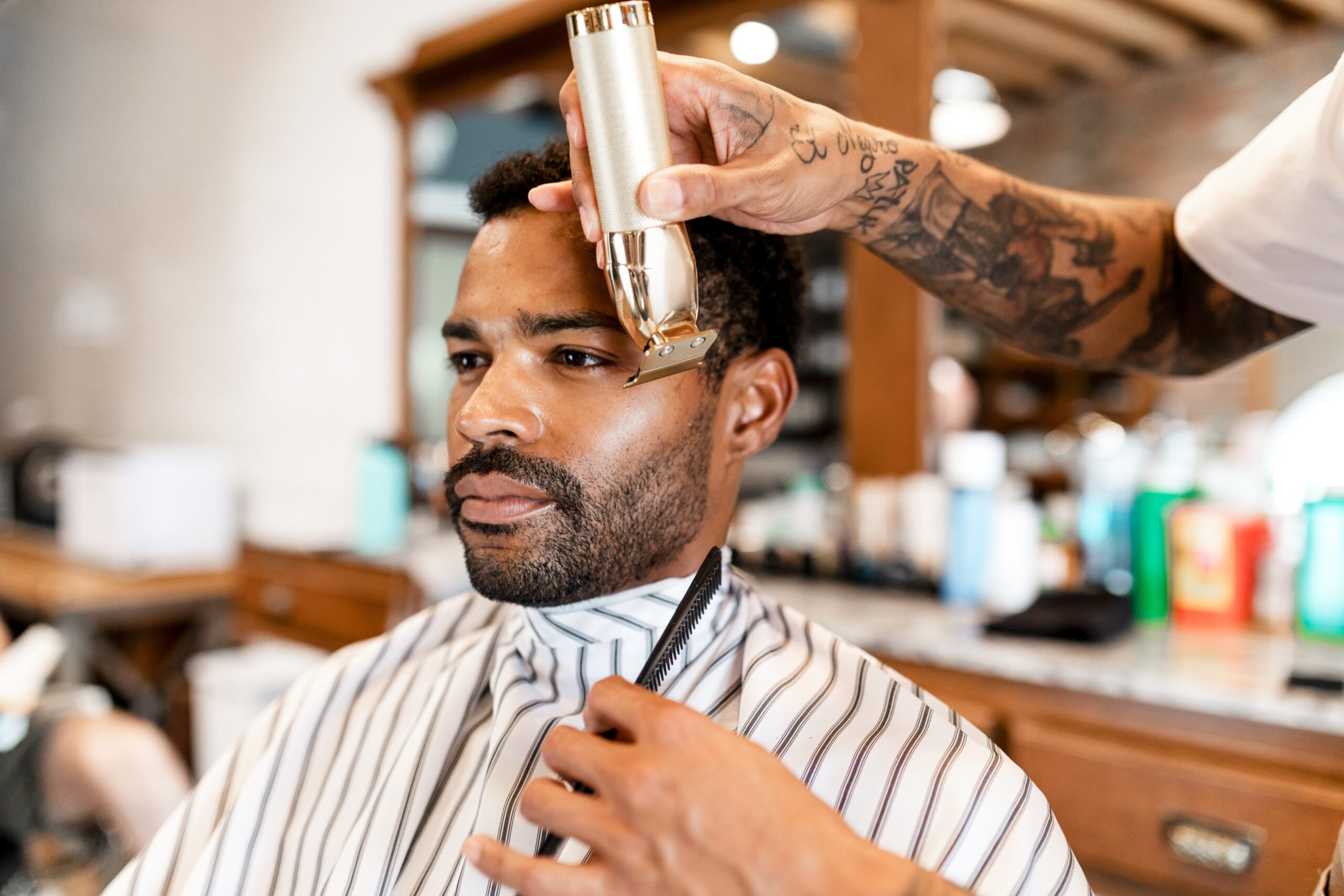 Customer Getting A Beard Trim In A Barber Shop