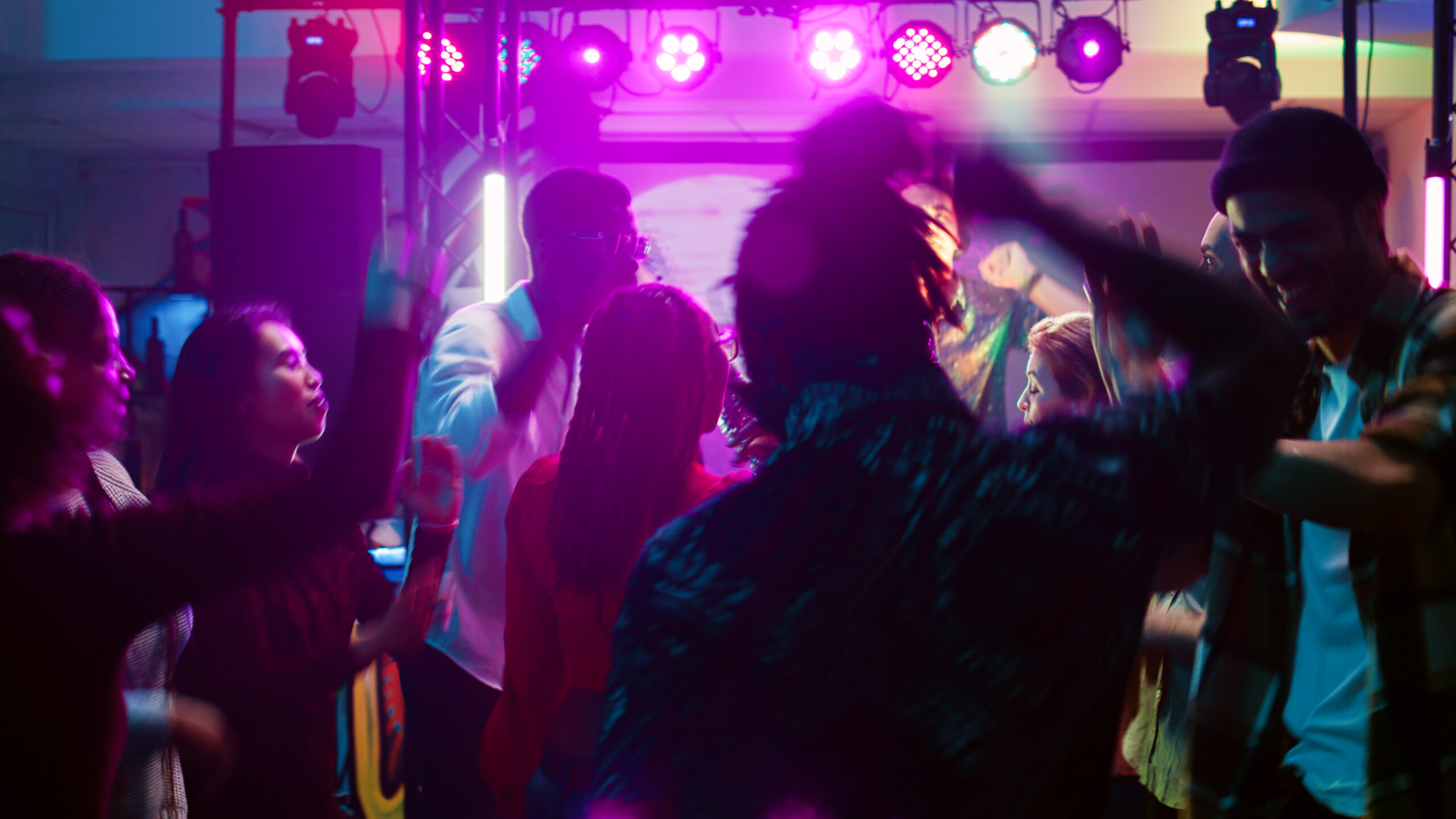 Enthusiastic People Dancing to Music at one of the best Nightclubs in Brighton
