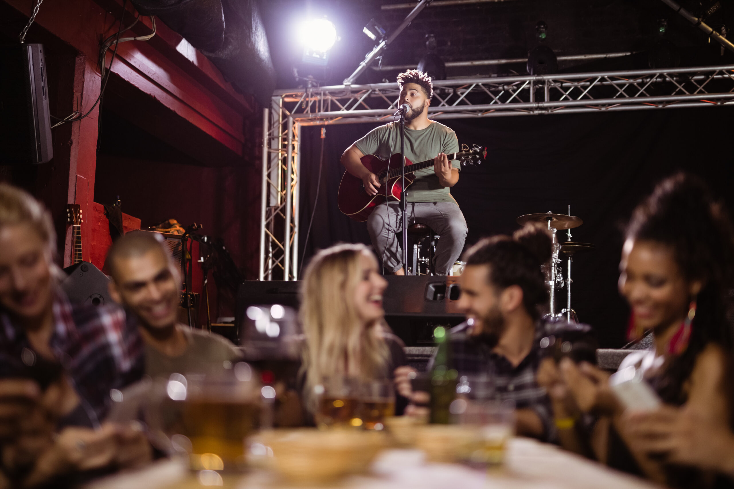 Live music in Brighton: Guitarist Entertaining People at a Local Pub
