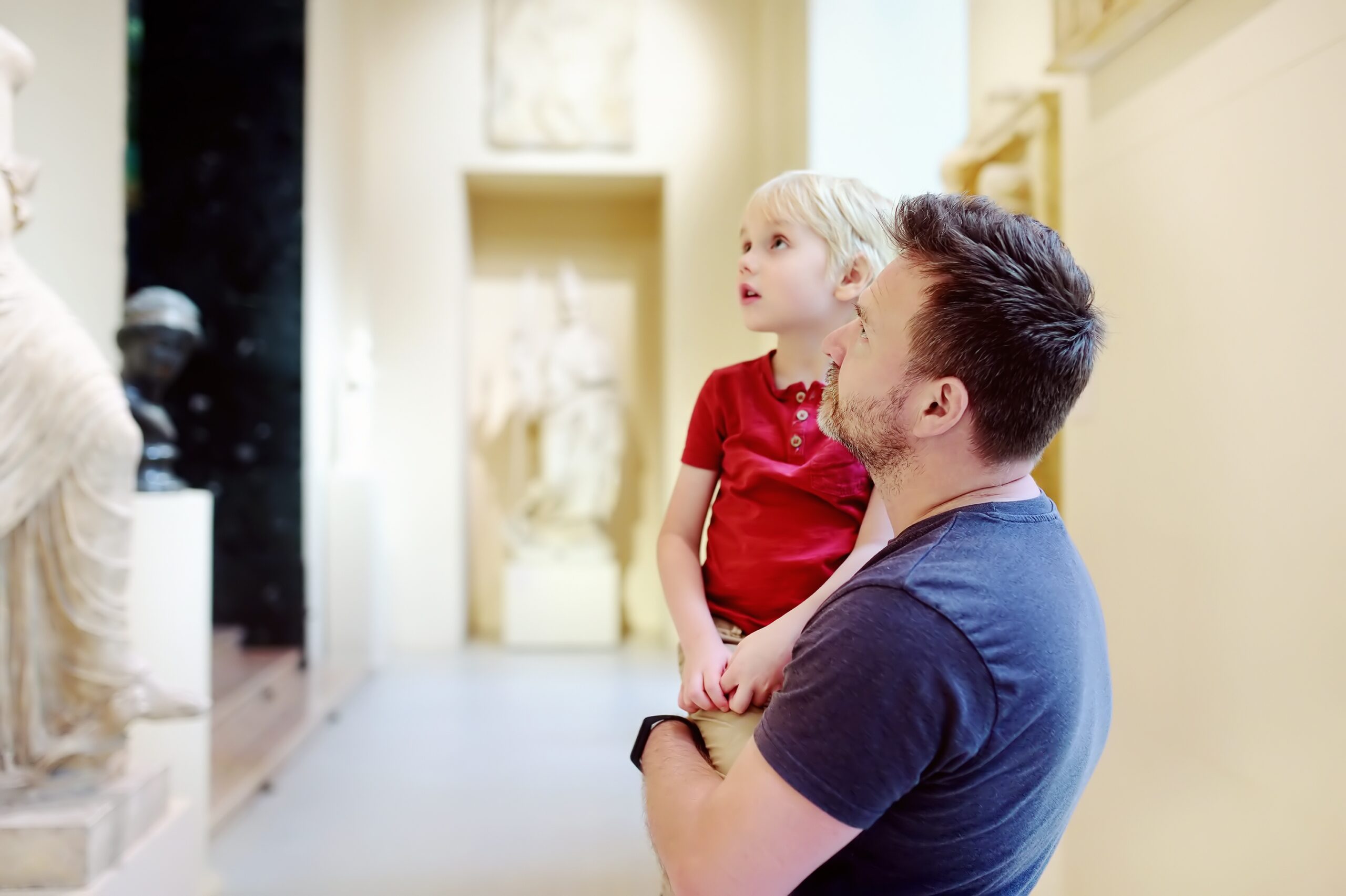 A father and son in a museum
