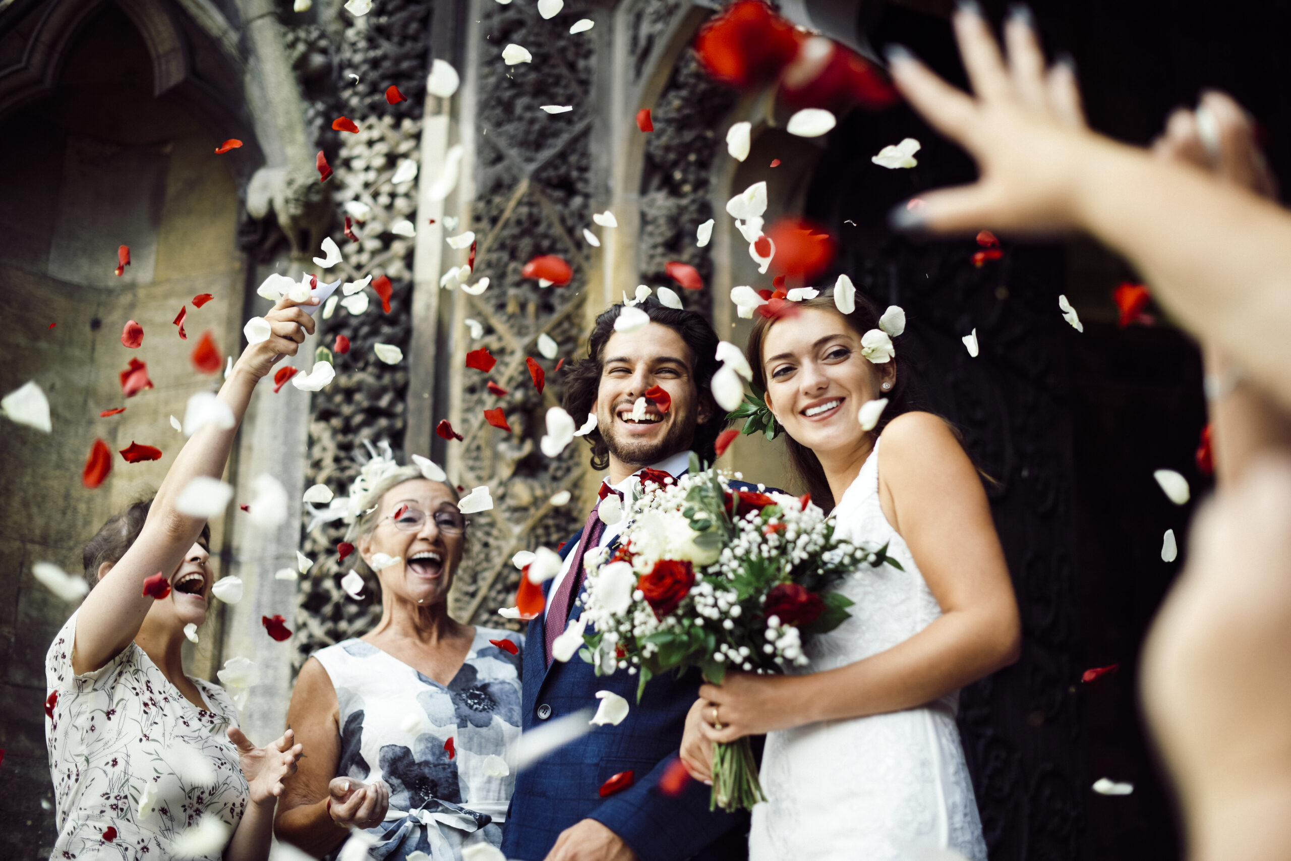 Wedding Couple Cheered On With Flower Petal Toss at one of the wedding venues in Brighton