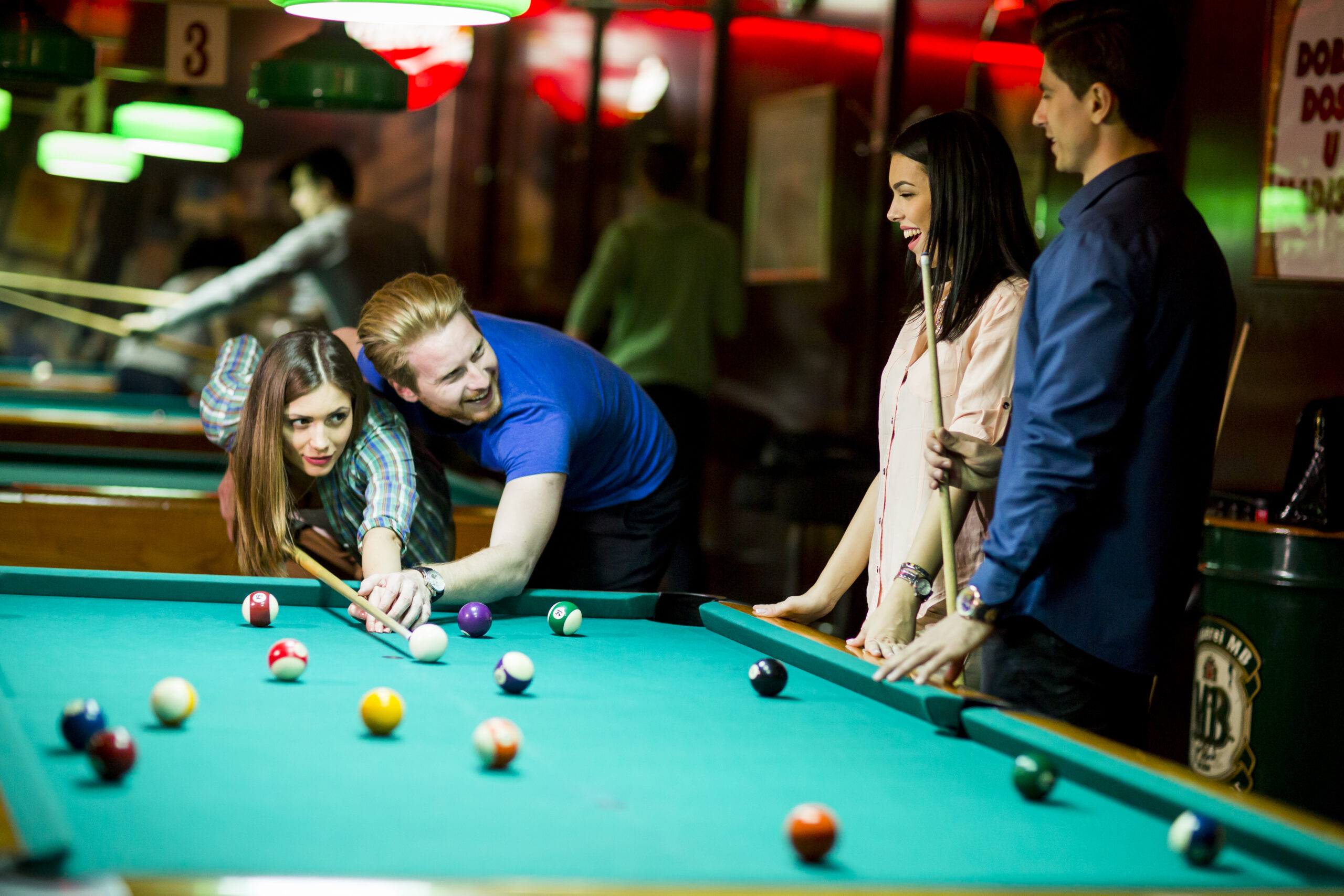 Young people playing pool