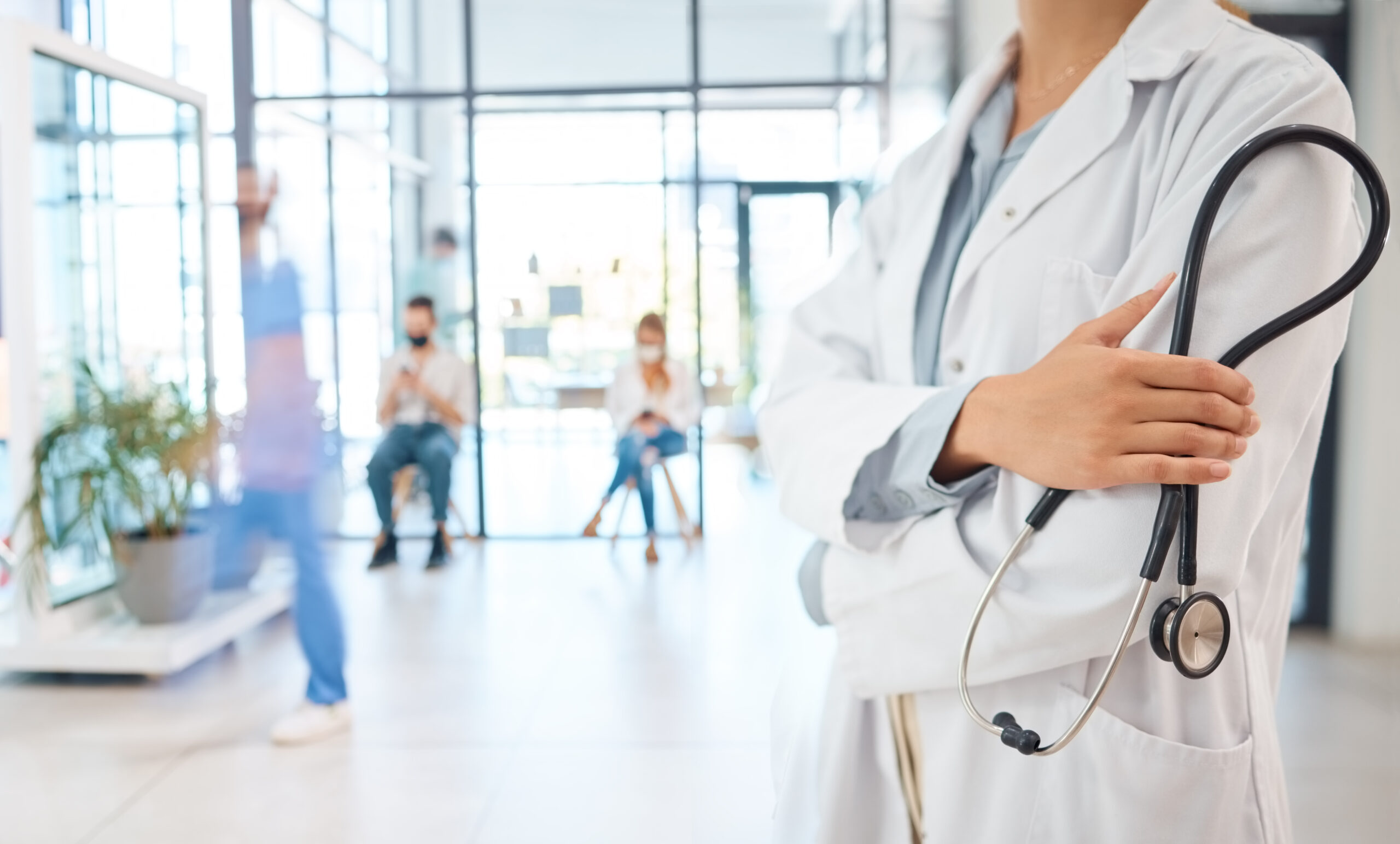 Hospitals in Brighton: Medical healthcare doctor, arms crossed confident with stethoscope.