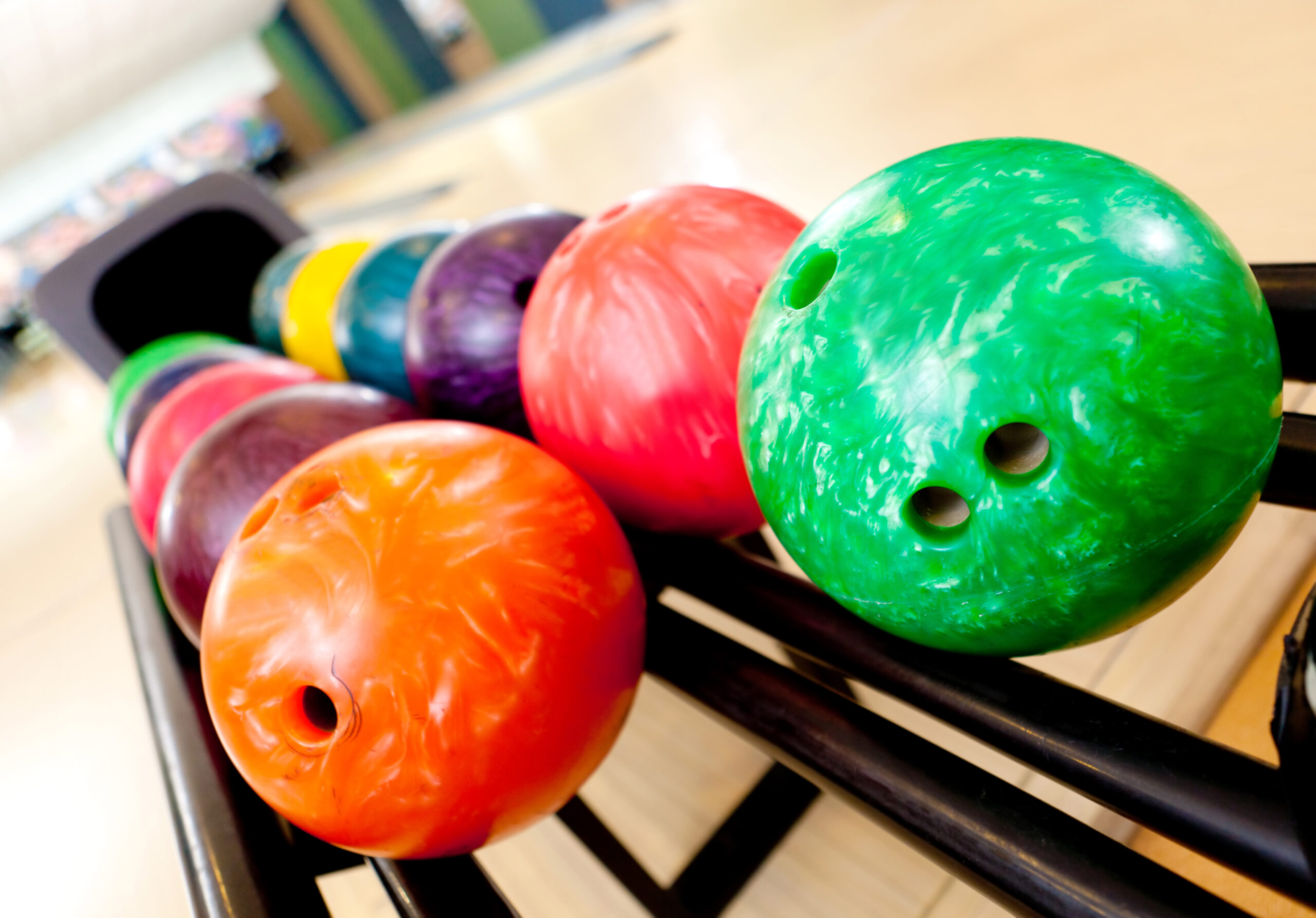Colorful Bowling Balls Ready For Play At an Alley 