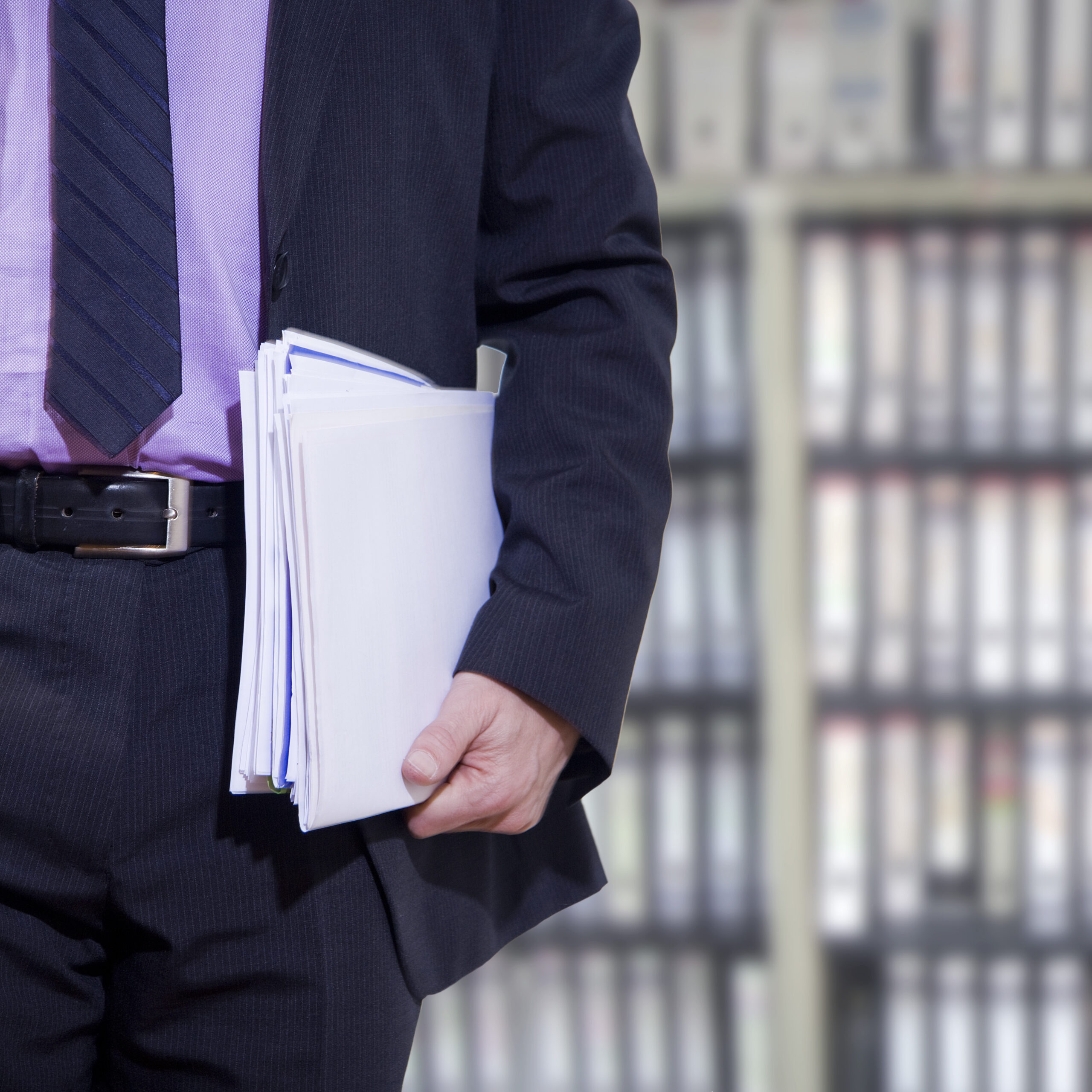 Executive Carries Documents In Office