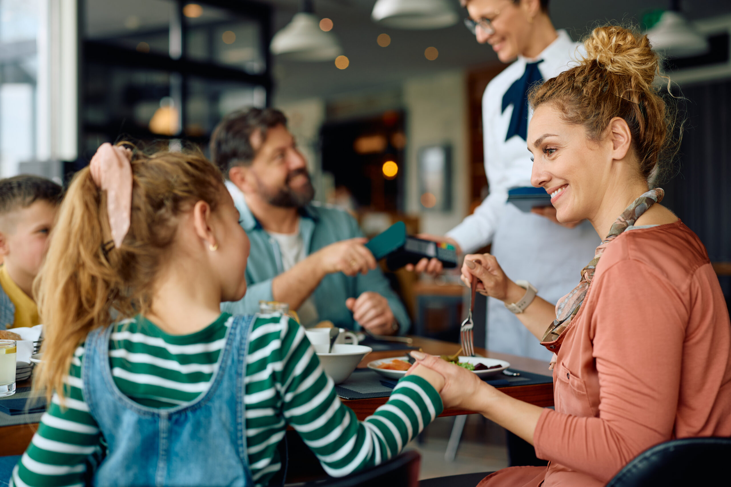 A happy family at a restaurant