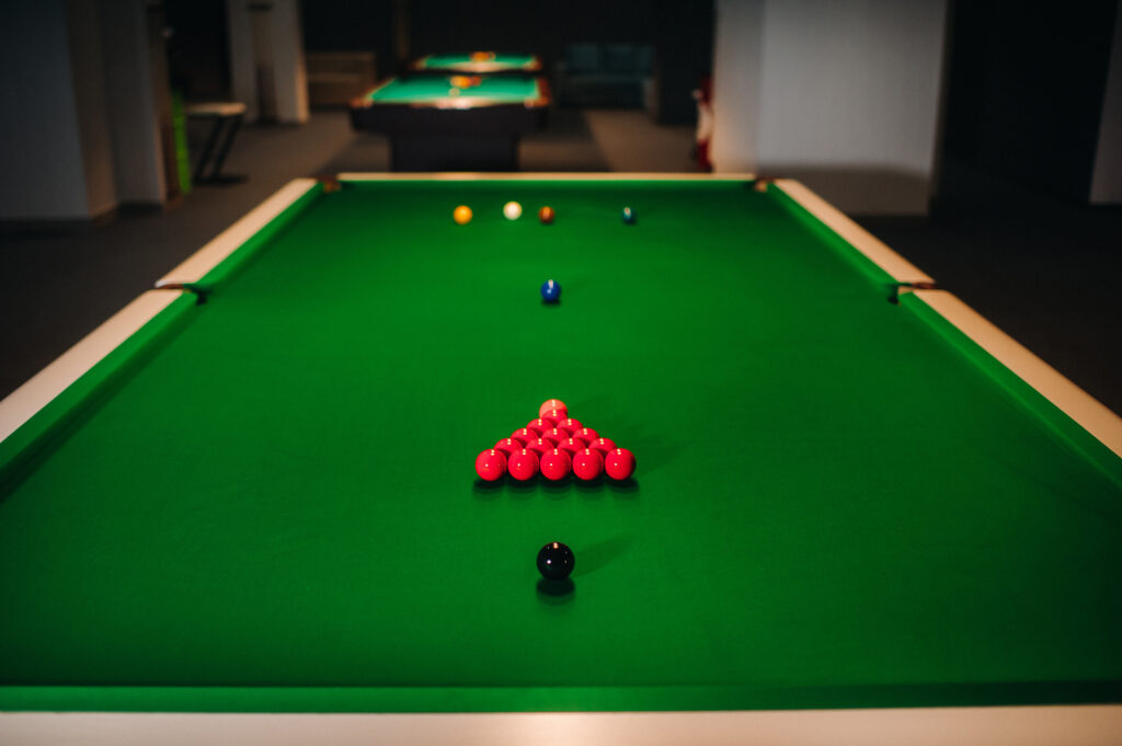 snooker balls on a green billiard table.