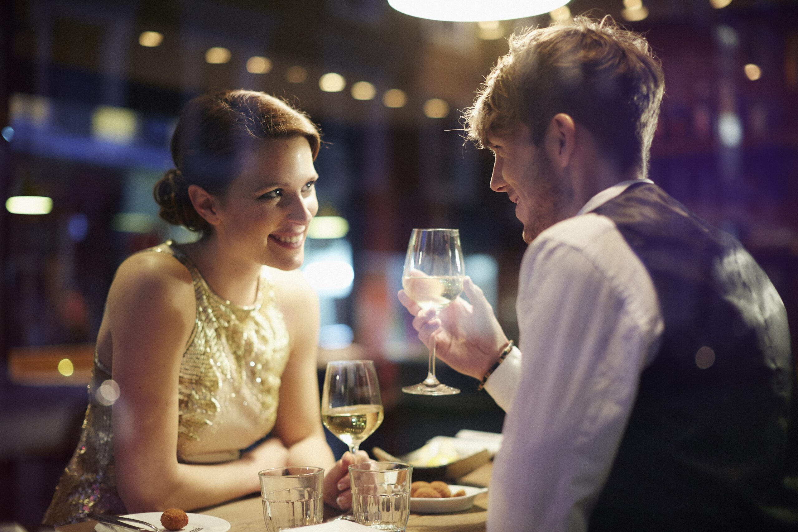 Romantic Dinner Date With Couple Toasting Wine Glass