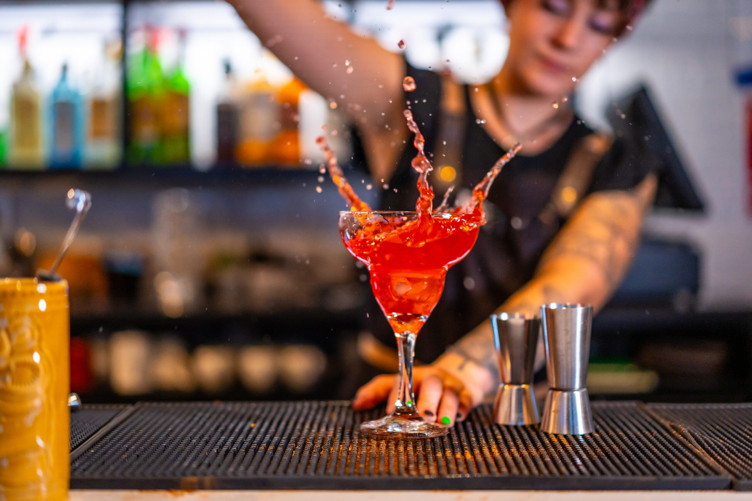 Bartender Creates A Cocktail With Big Red Splash 