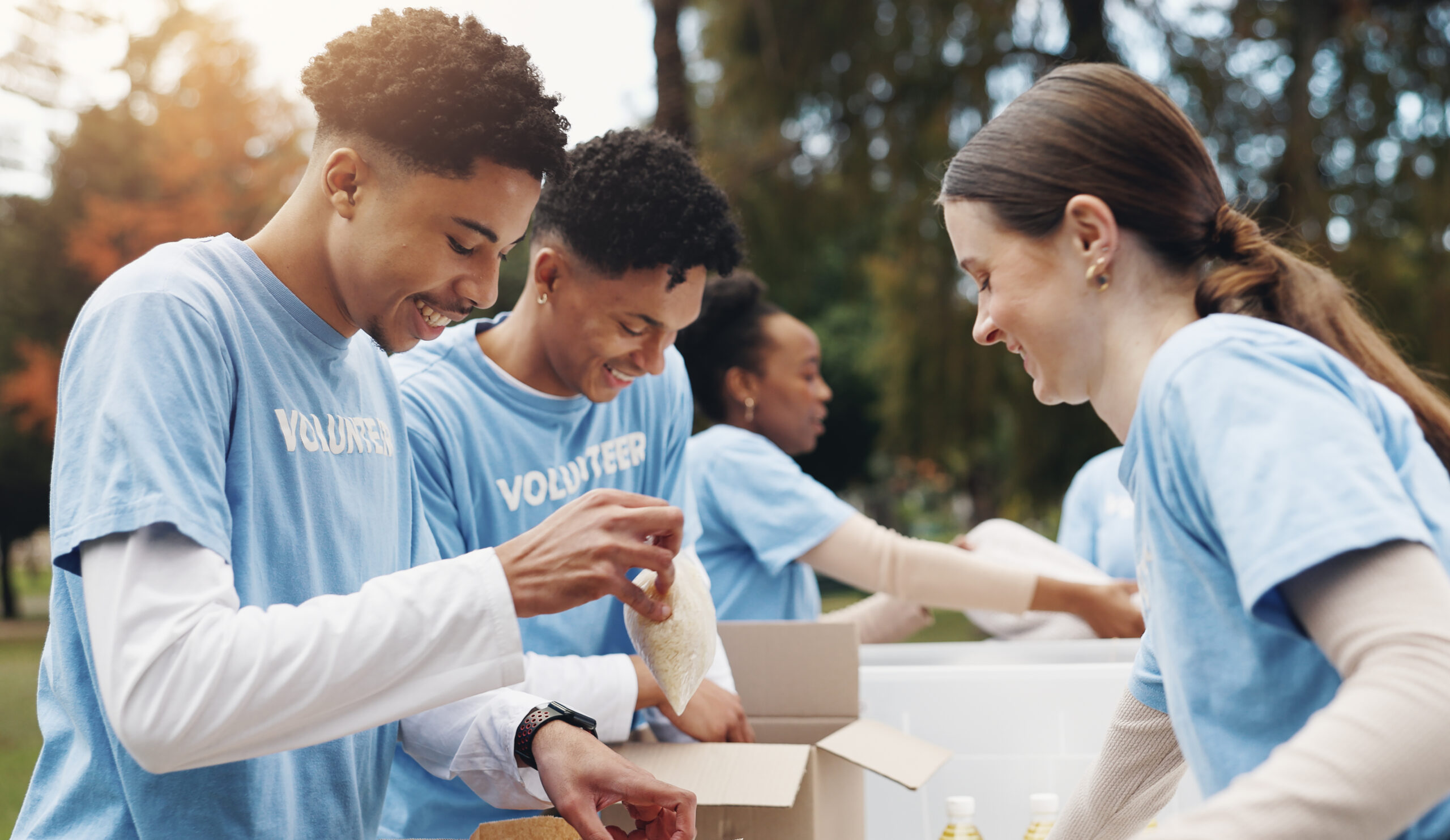 A team of volunteers outdoors smiling