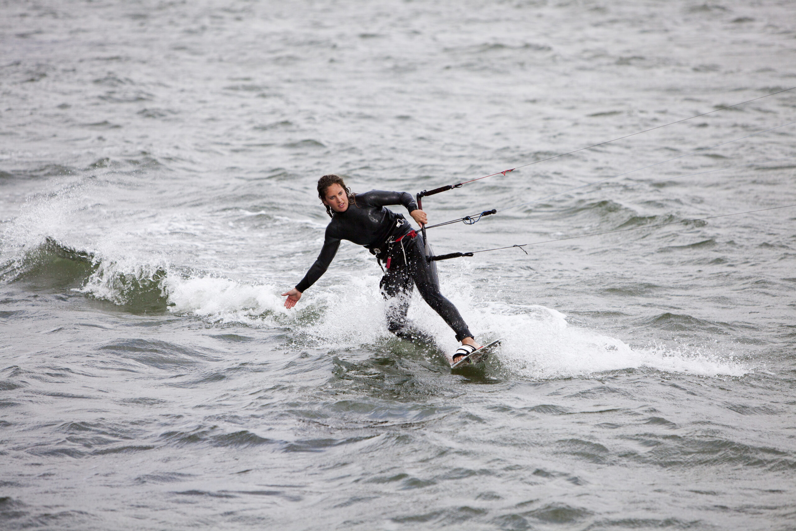 High angle view of young woman kiteboarding on sea