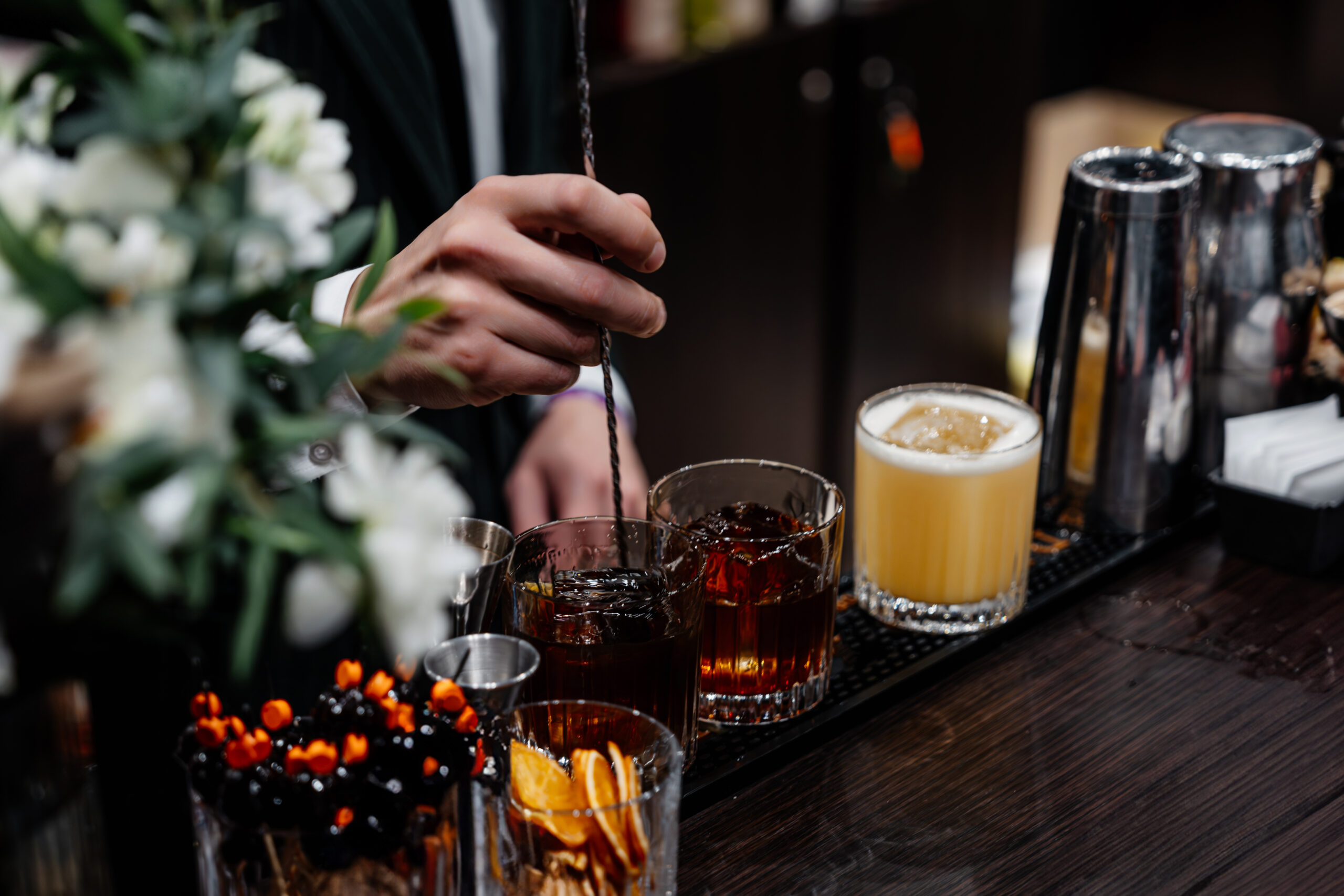 Mixing cocktails at a bar
