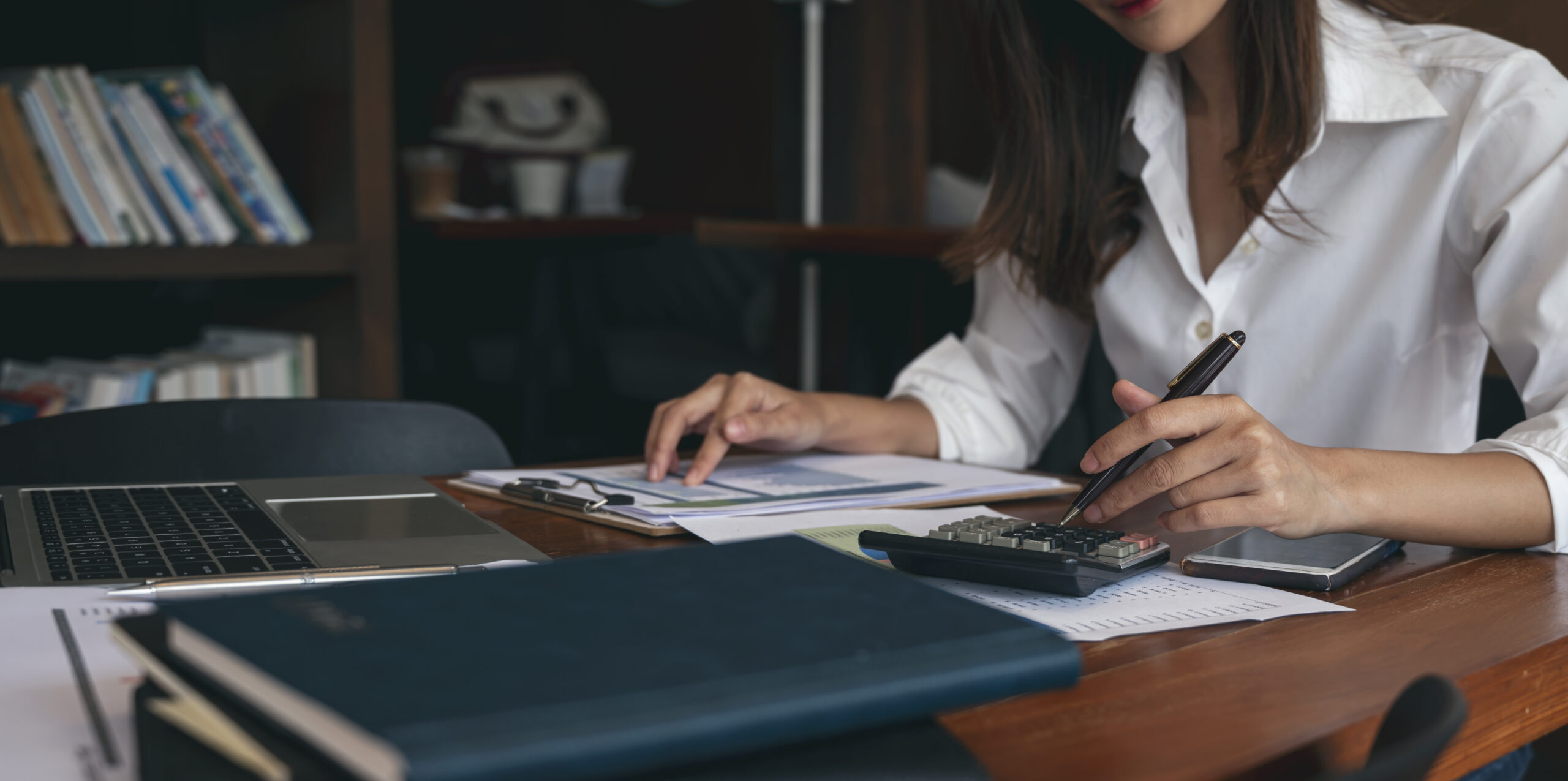 Business Woman Working with a Calculator