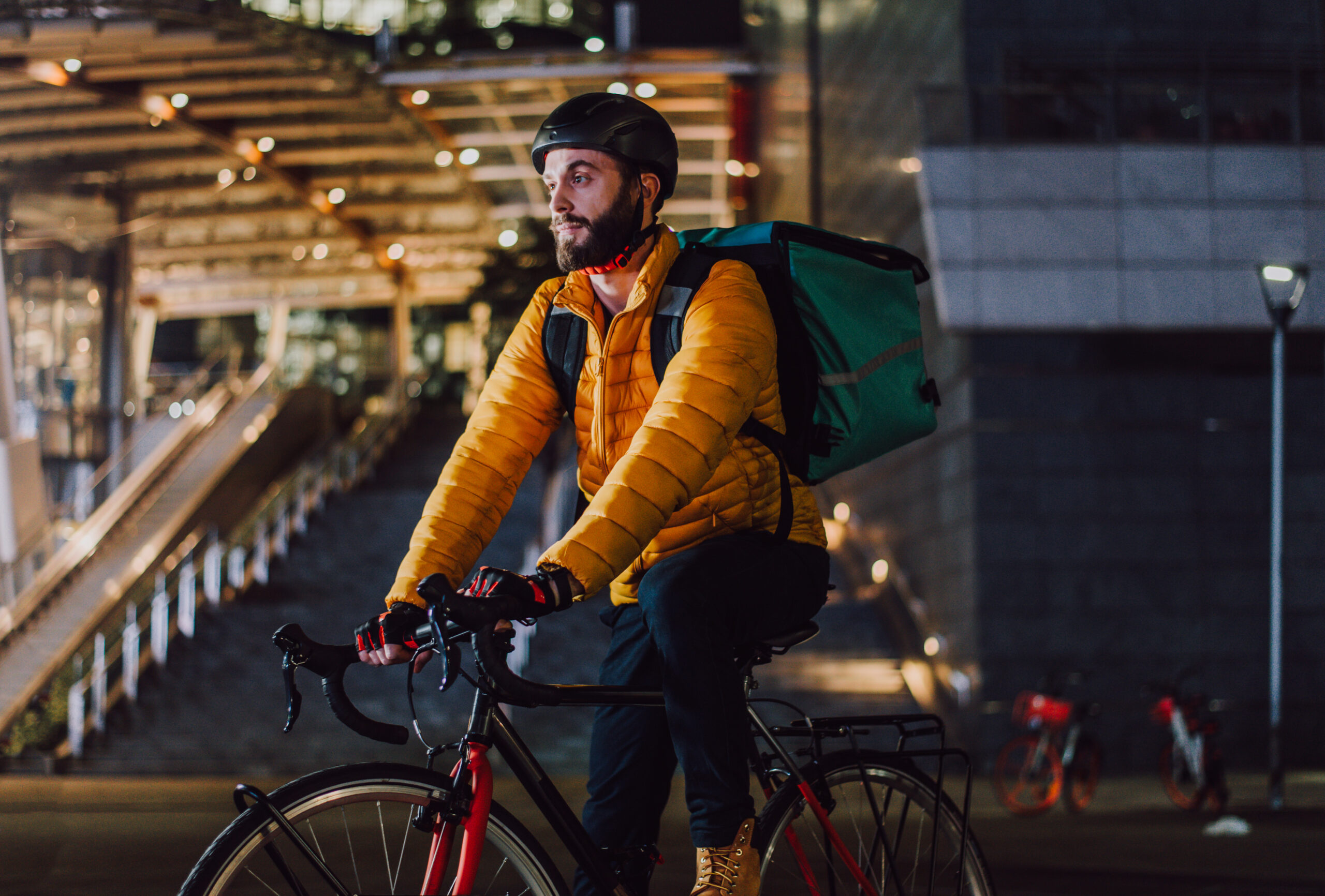 Food delivery service, rider delivering food to clients with bicycle