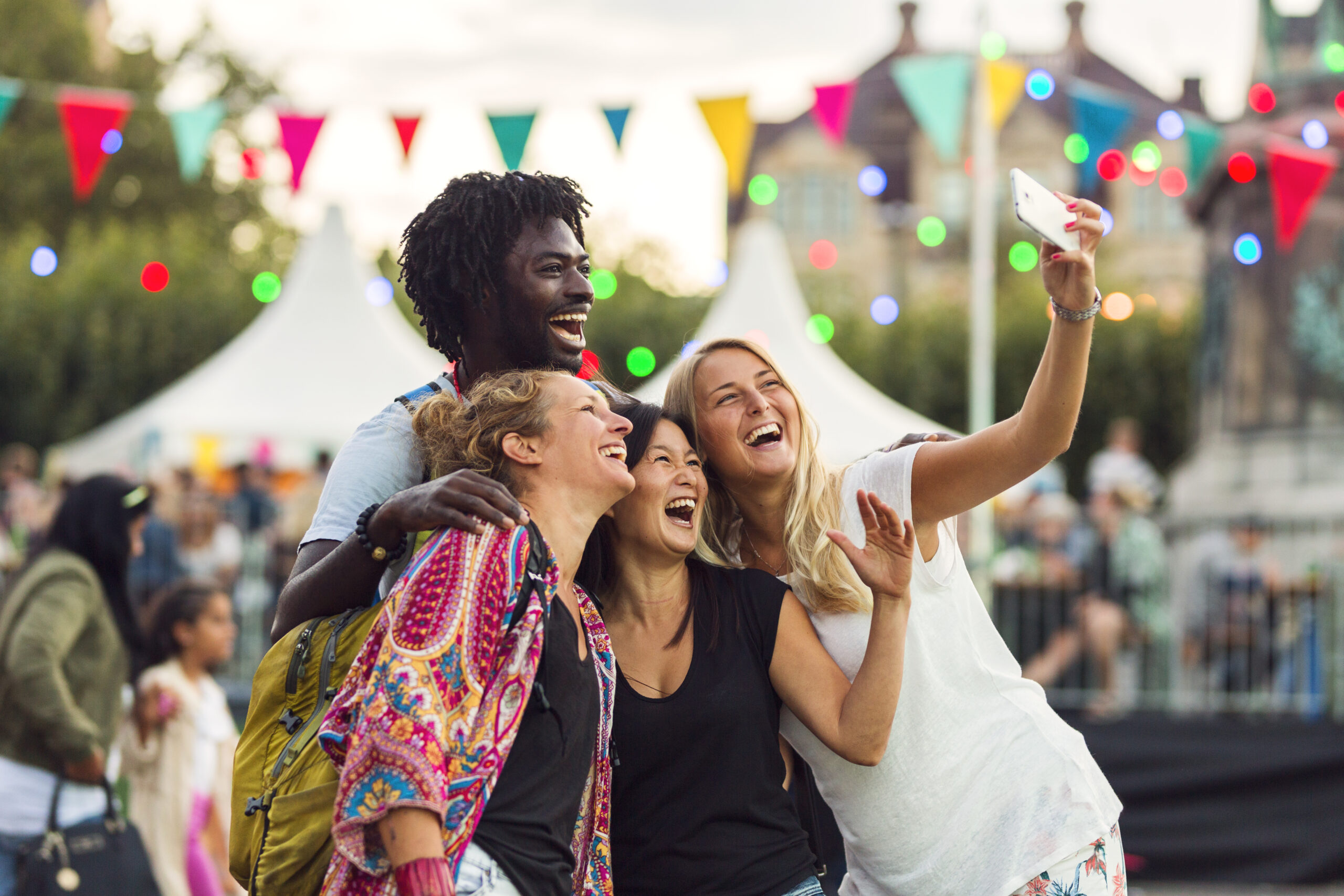 Friends Taking A Selfie At An Outdoor Festival 