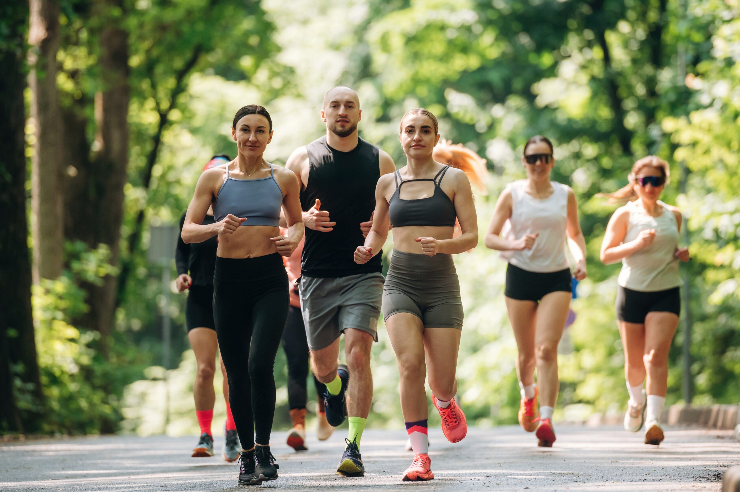 Group Of Adults Running Outside On aSunny Day 
