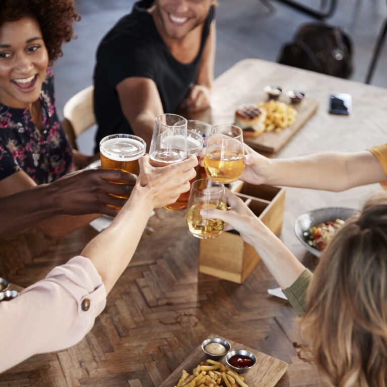 Group Of Young Friends Meeting For Bottomless brunch in Brighton