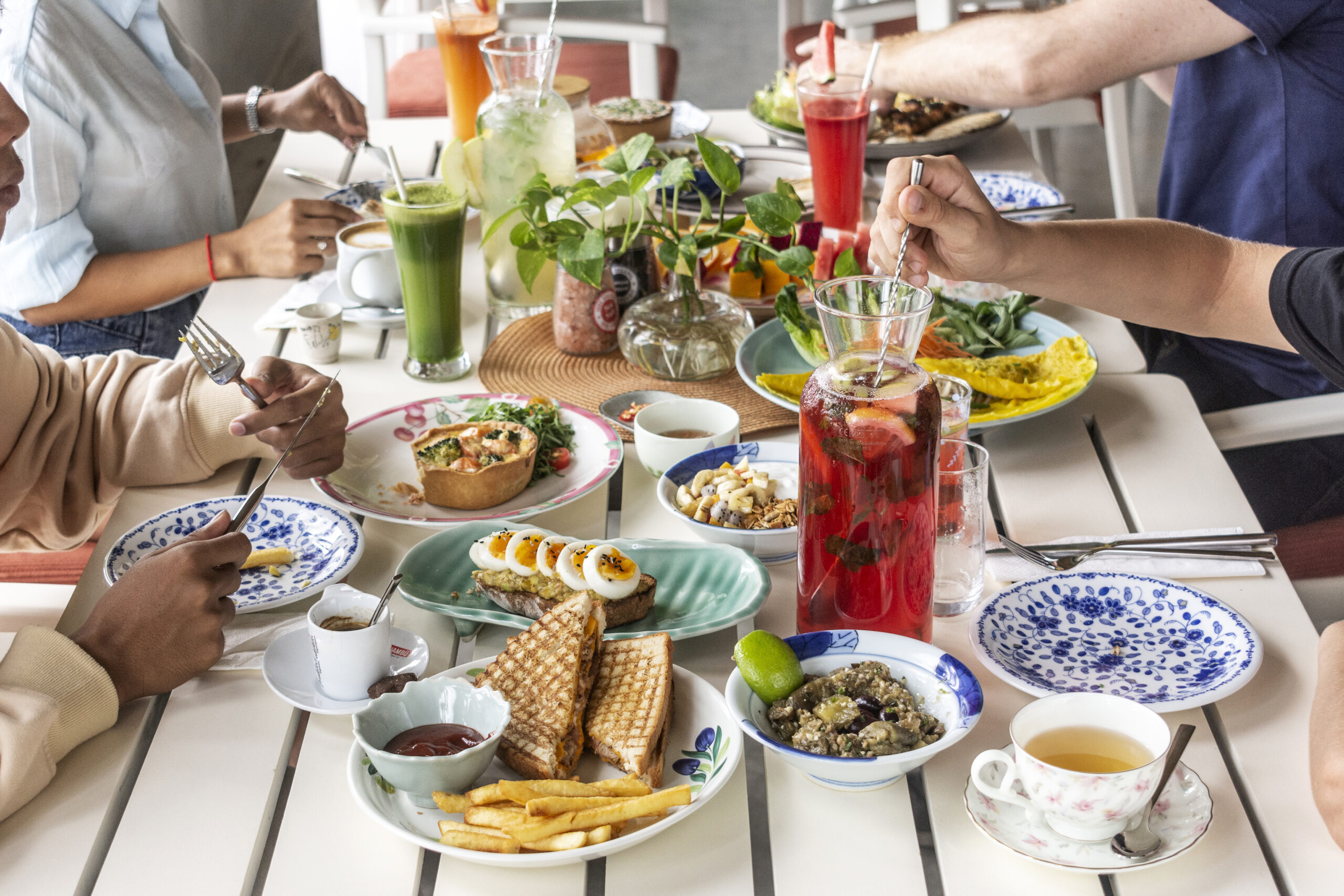 mixed healthy food meal on restaurant table outdoors