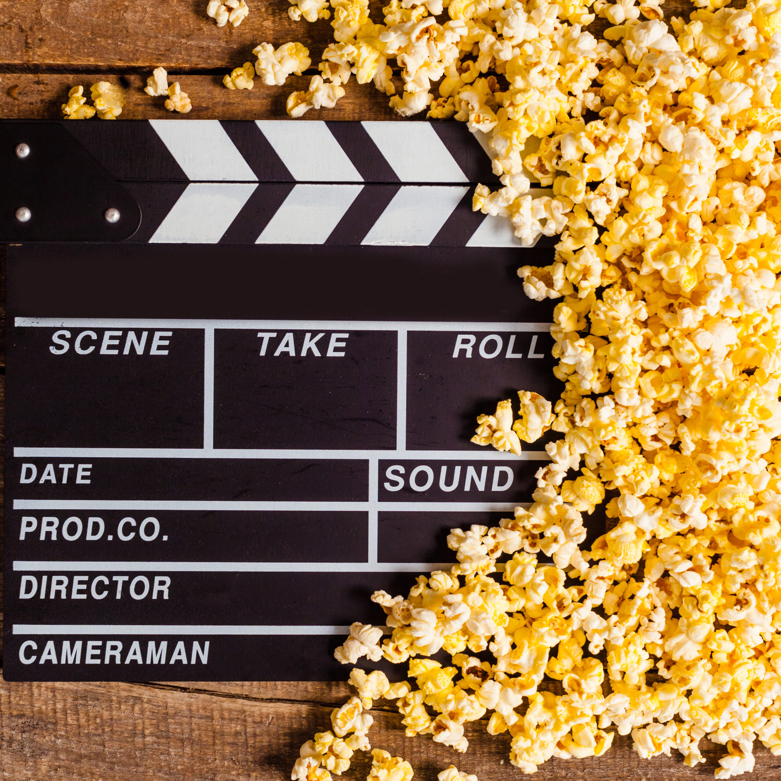 Movie Clapperboard Surrounded by Delicious Yellow Popcorn