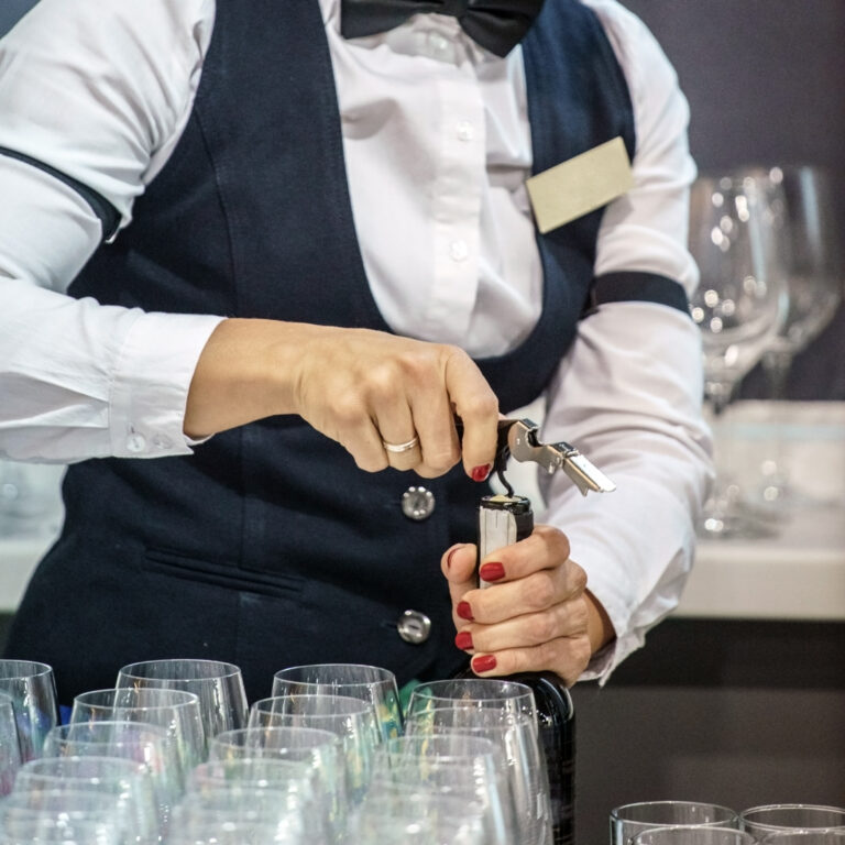 Sommelier Opening Wine Bottle At a wine Bar in Brighton