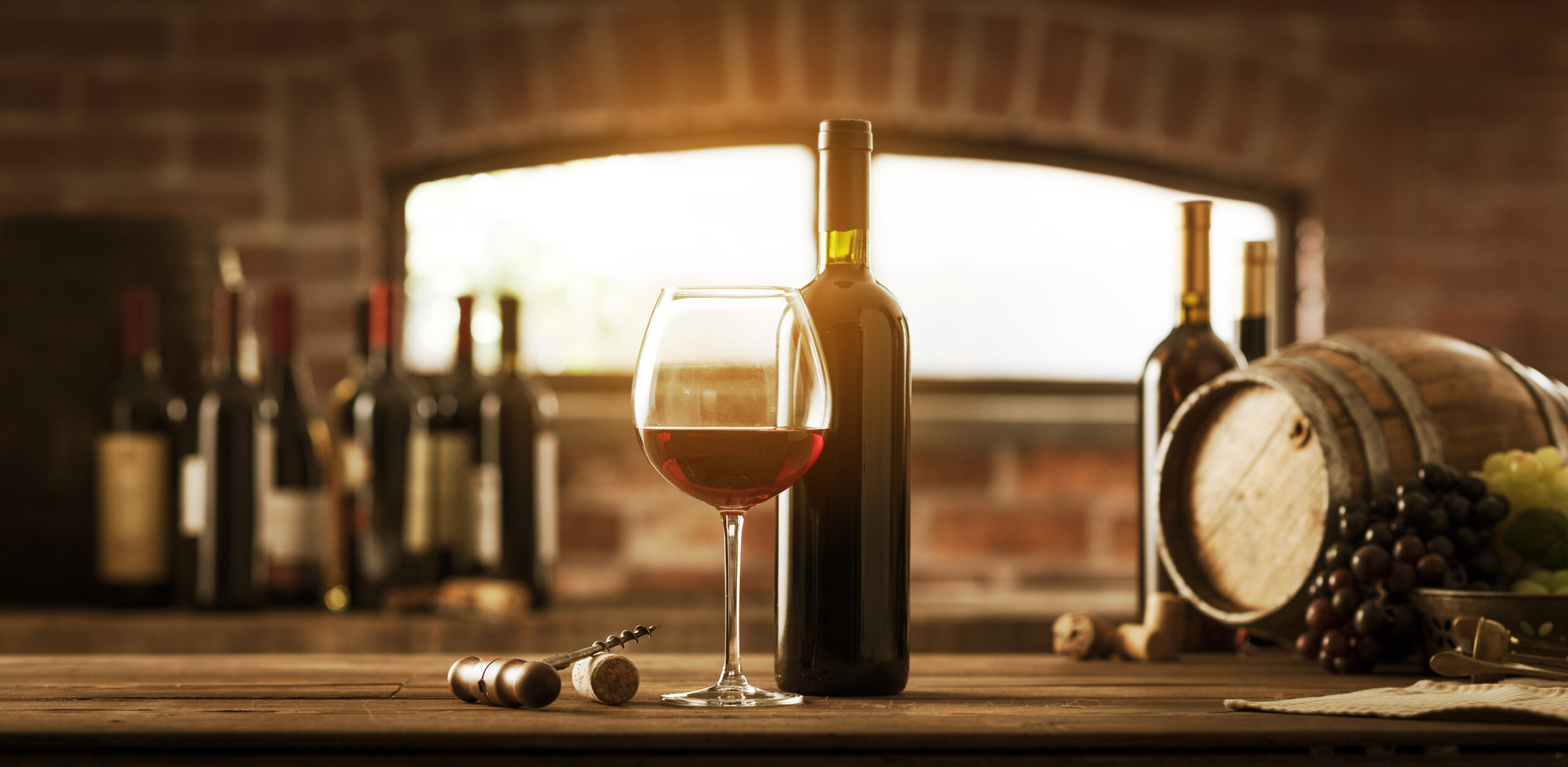 Wine And Grapes On A Wooden Table
