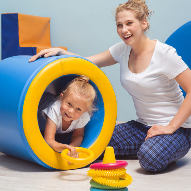 Woman And Child Enjoying Playful Activity Indoors