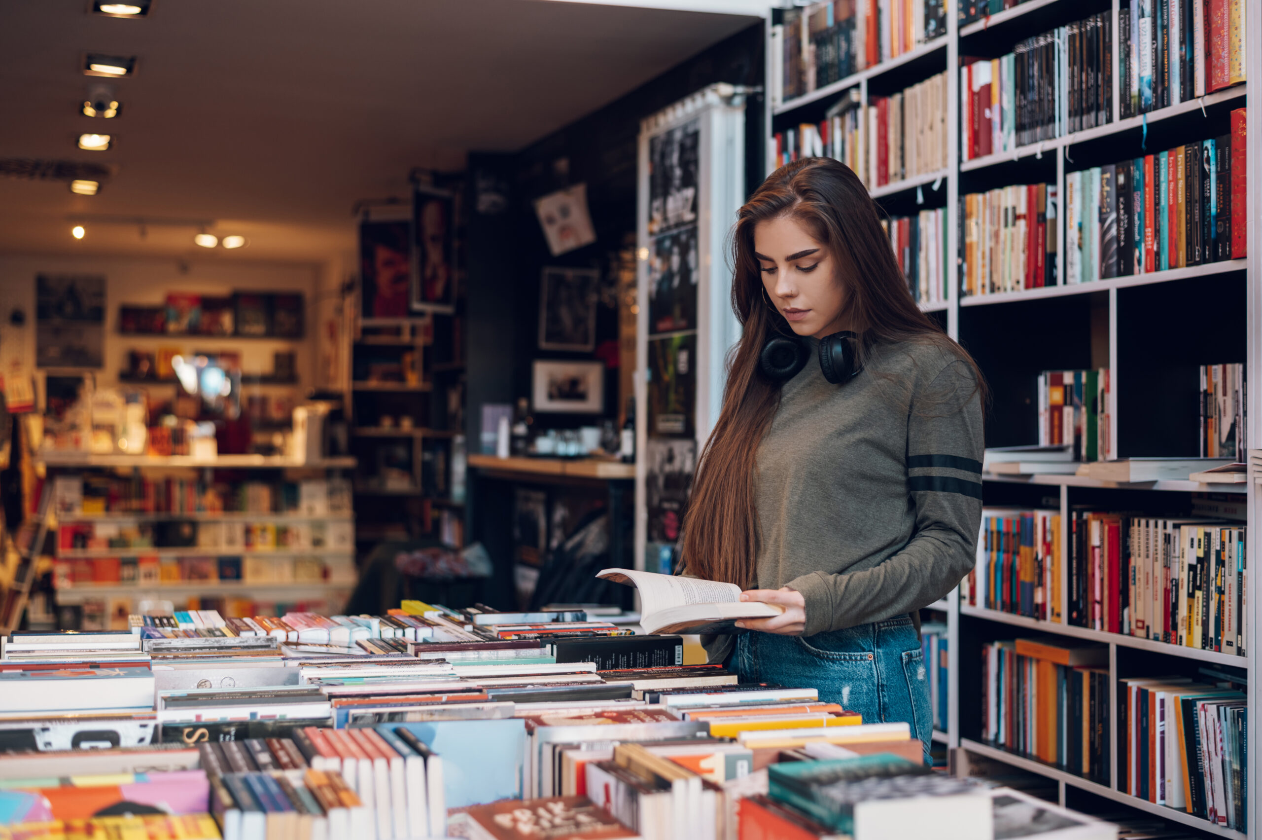 Woman Reads A Book In a Bookstore 