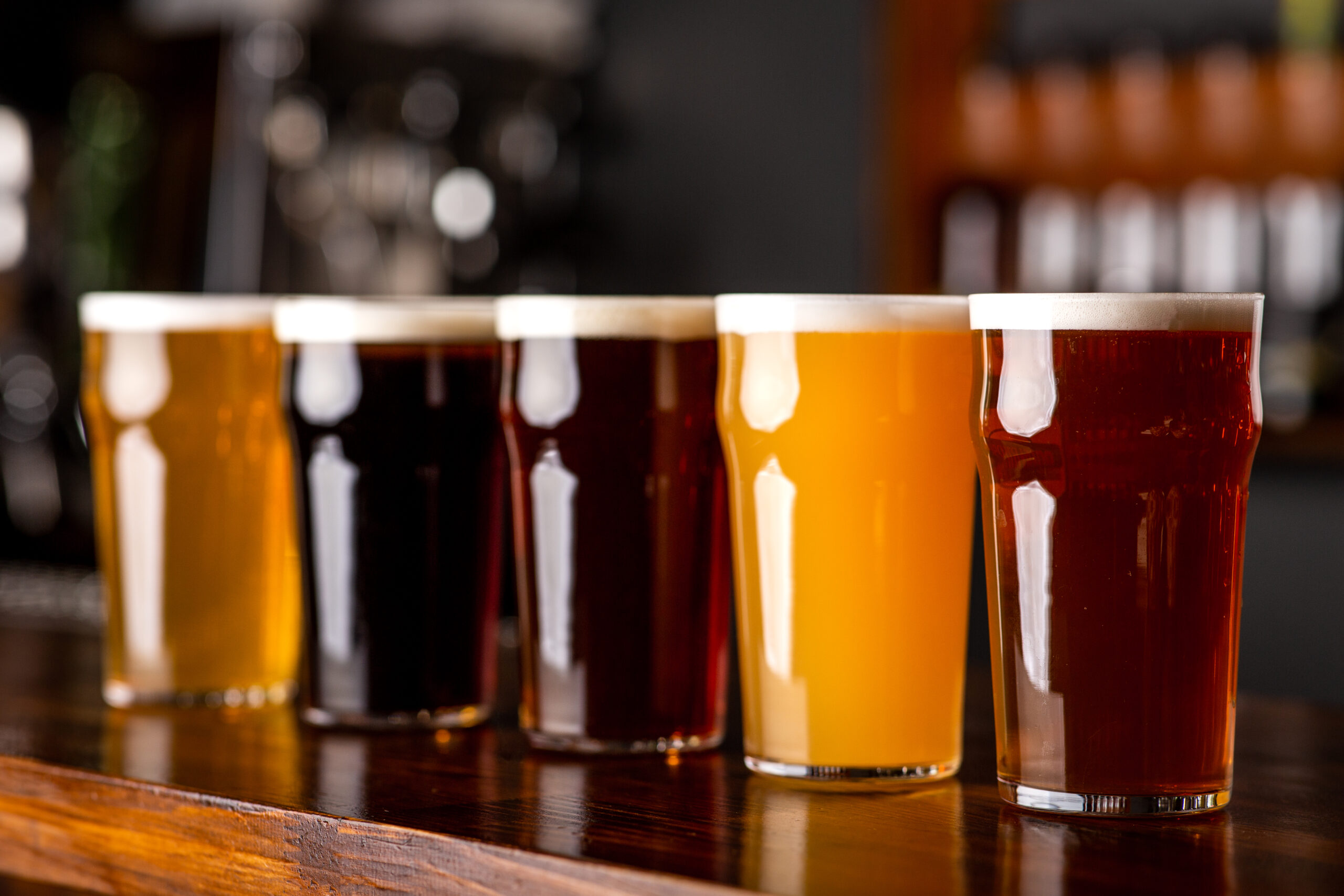 Dark Light Barley Lager And Ale In Glasses On a Bar