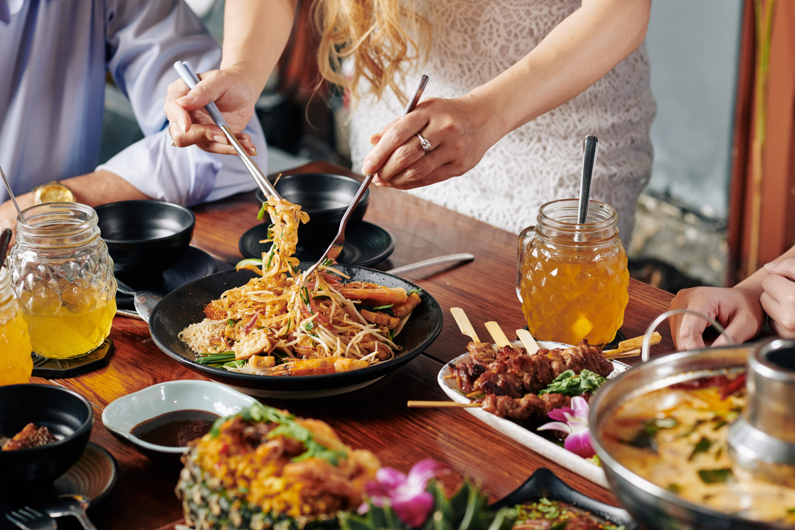 Friends Enjoying Delicious Thai Food Together