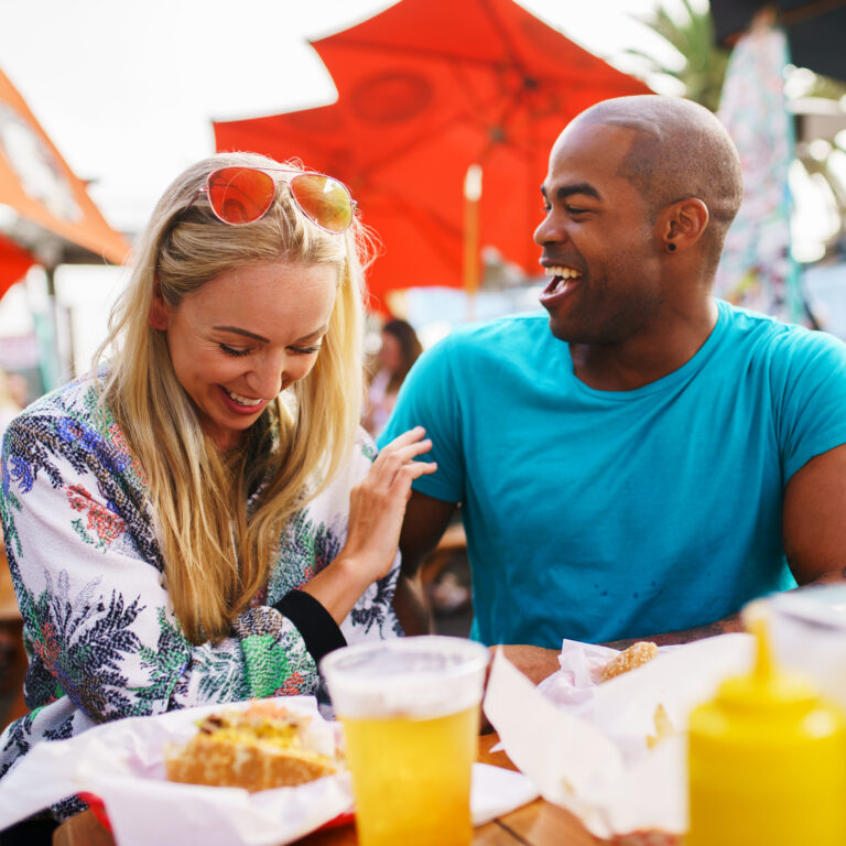playful couple eating at Brighton foodies festival