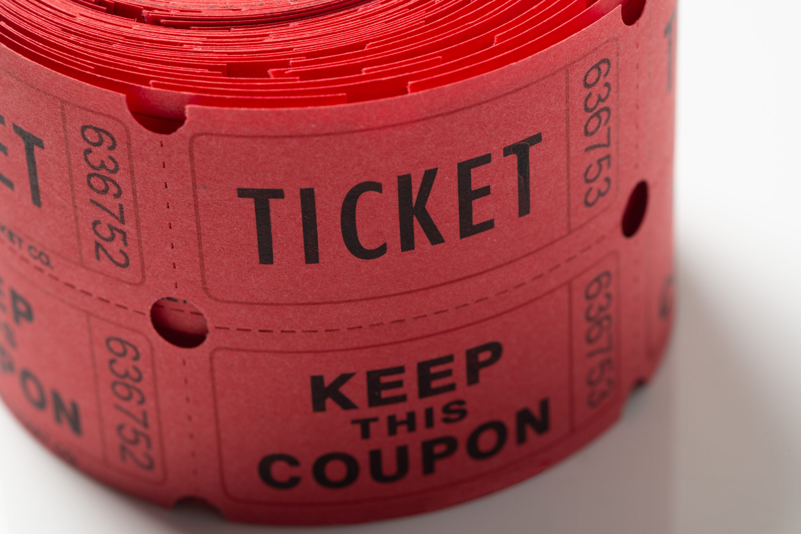 Close up roll of red tickets used for entrance into an event or entertainment