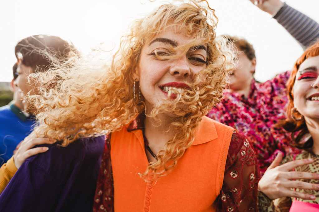 Happy young people dancing outdoor at festival event