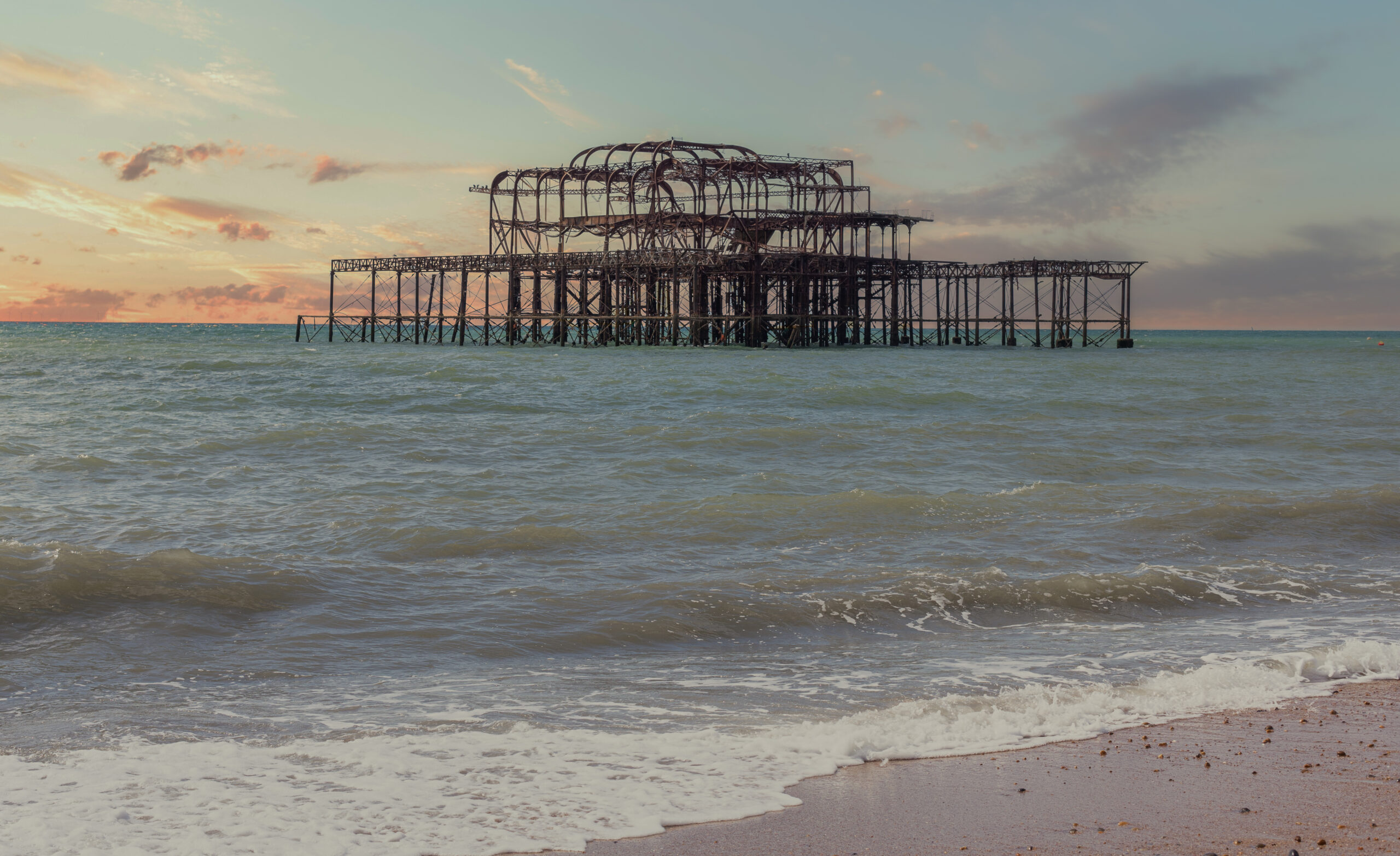 A sunset over Brighton's historic west pier