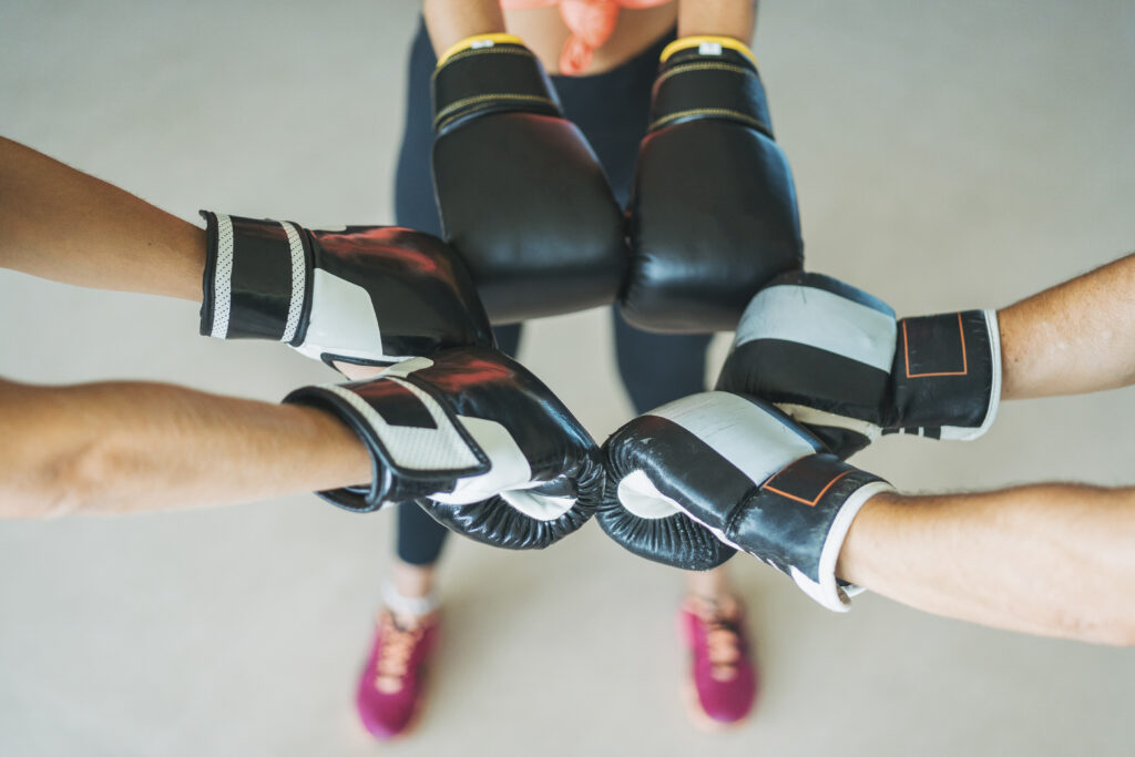 Close Up Of Training Partners With Boxing Gloves