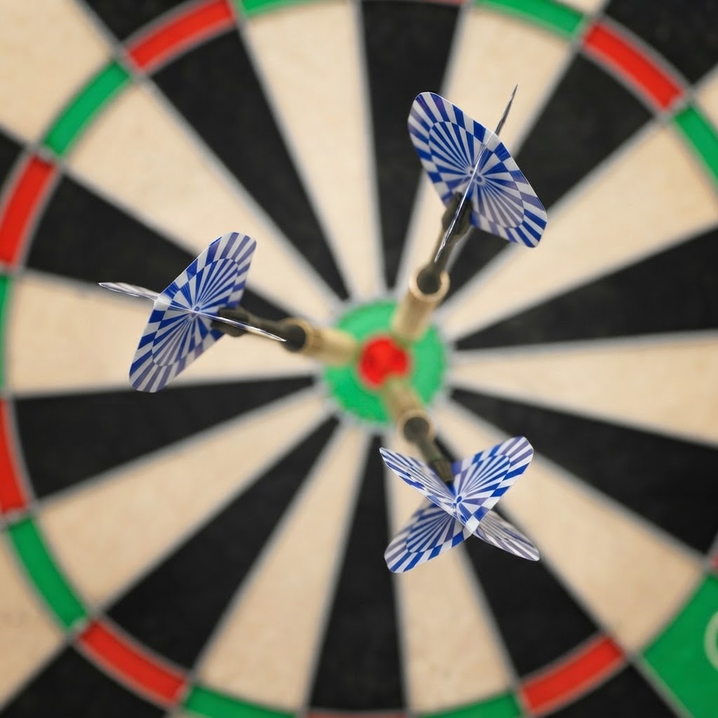 close up of darts in Brighton on a dartboard