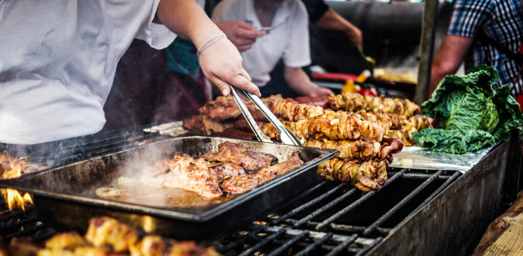 cooking meat barbecue on fire