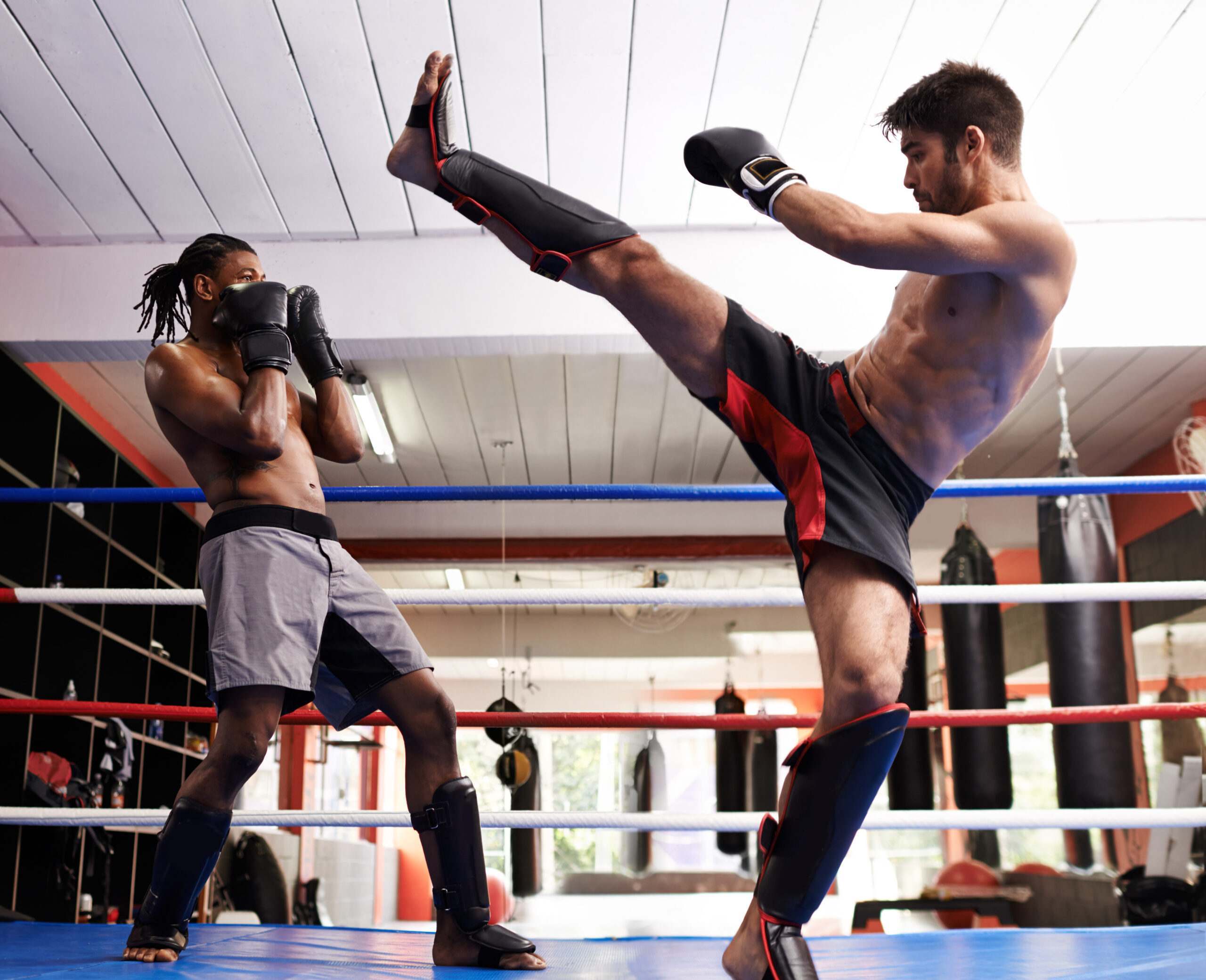 Men Practicing Martial Arts In The Ring