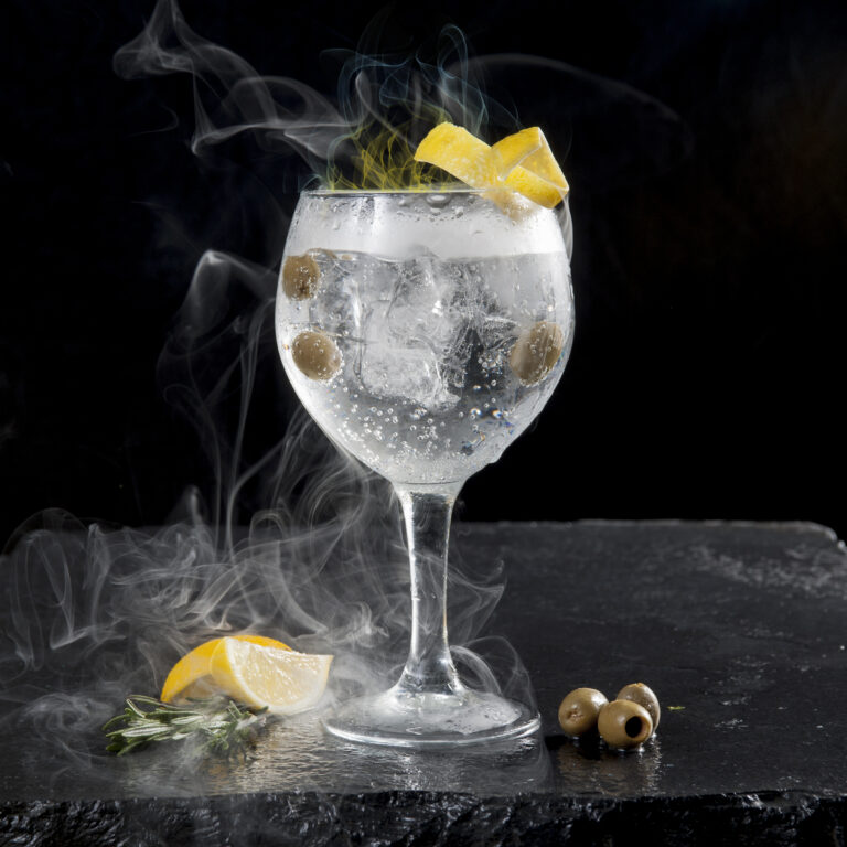 Refreshing Gin And Tonic With Olives And Lemon