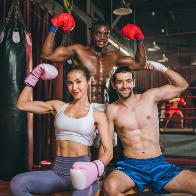 Three Boxers Posing In a Gym After doing martial arts in Brighton