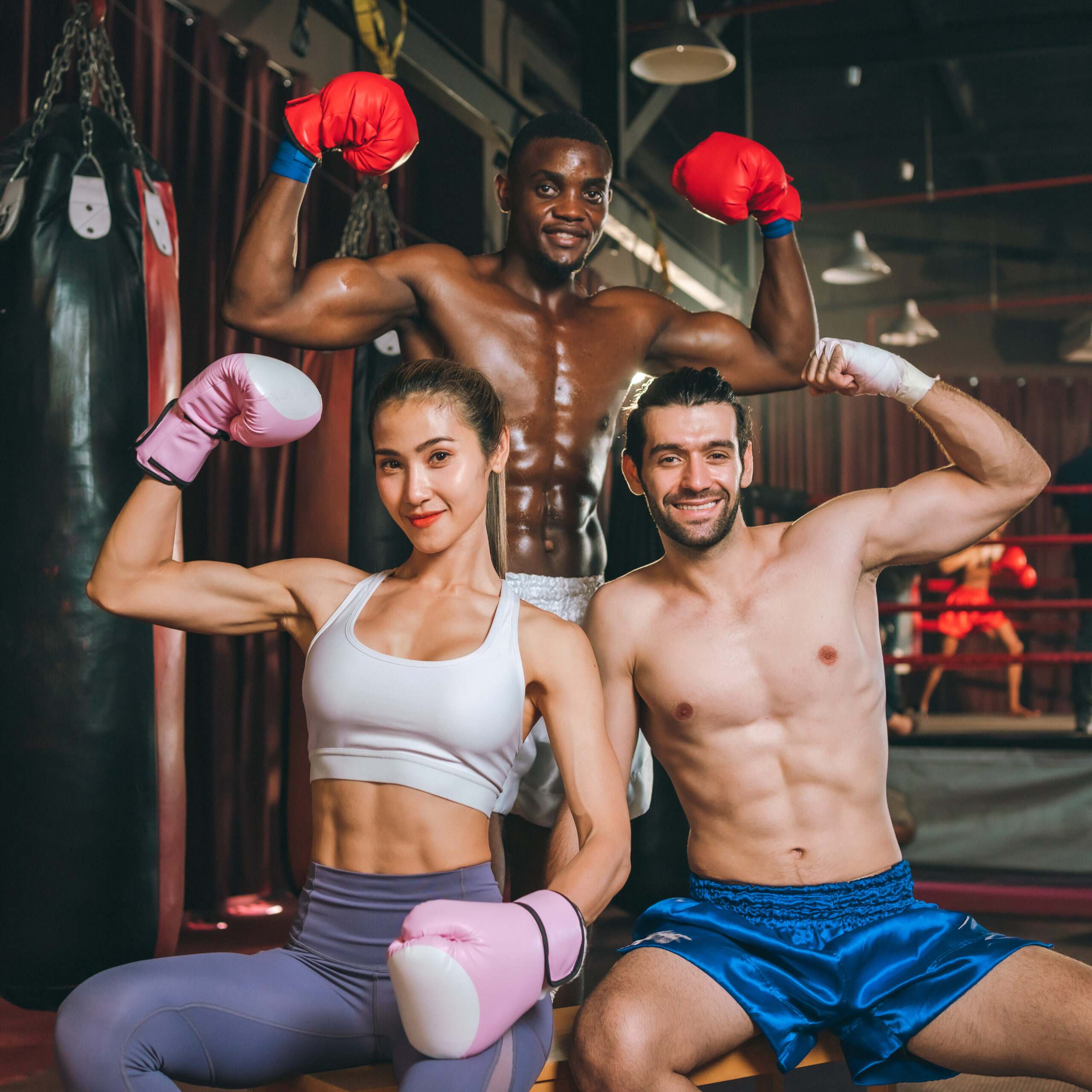 Three Boxers Posing In a Gym After doing martial arts in Brighton