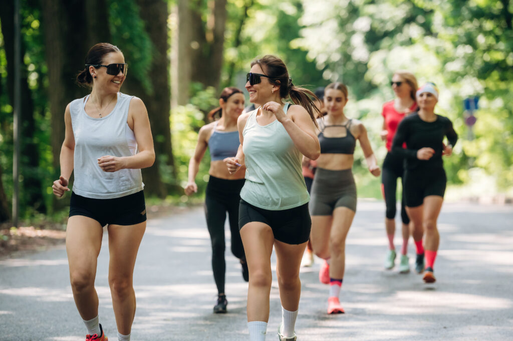 Women Enjoying A Summer Morning Run Outdoors
