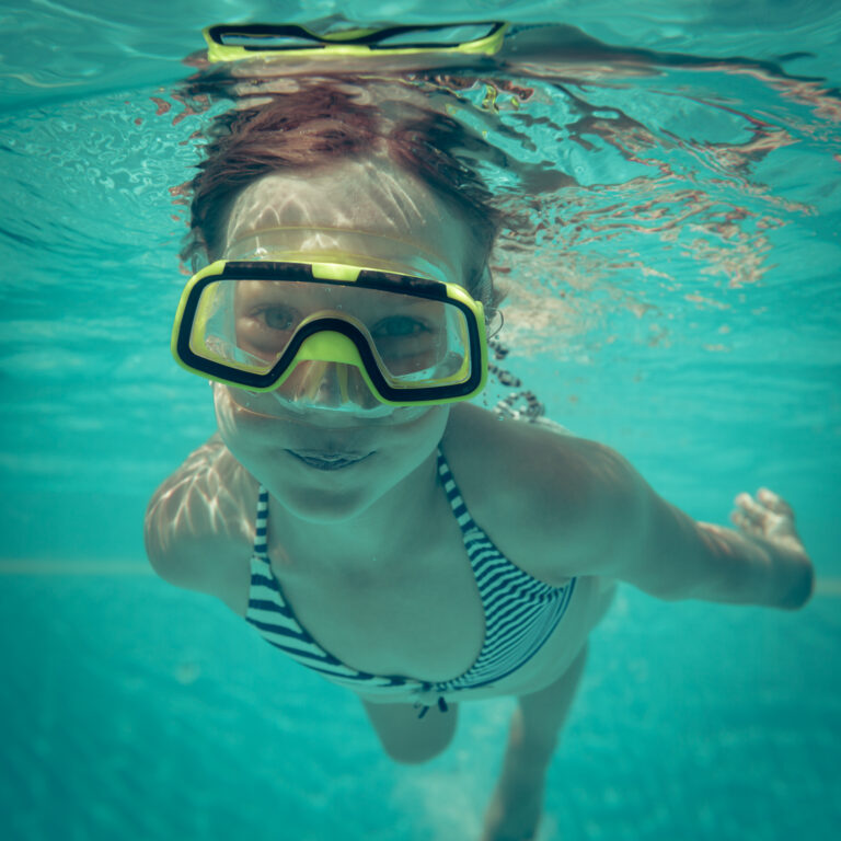 Things to Do in Brighton with Kids: Child Swims Underwater With Goggles