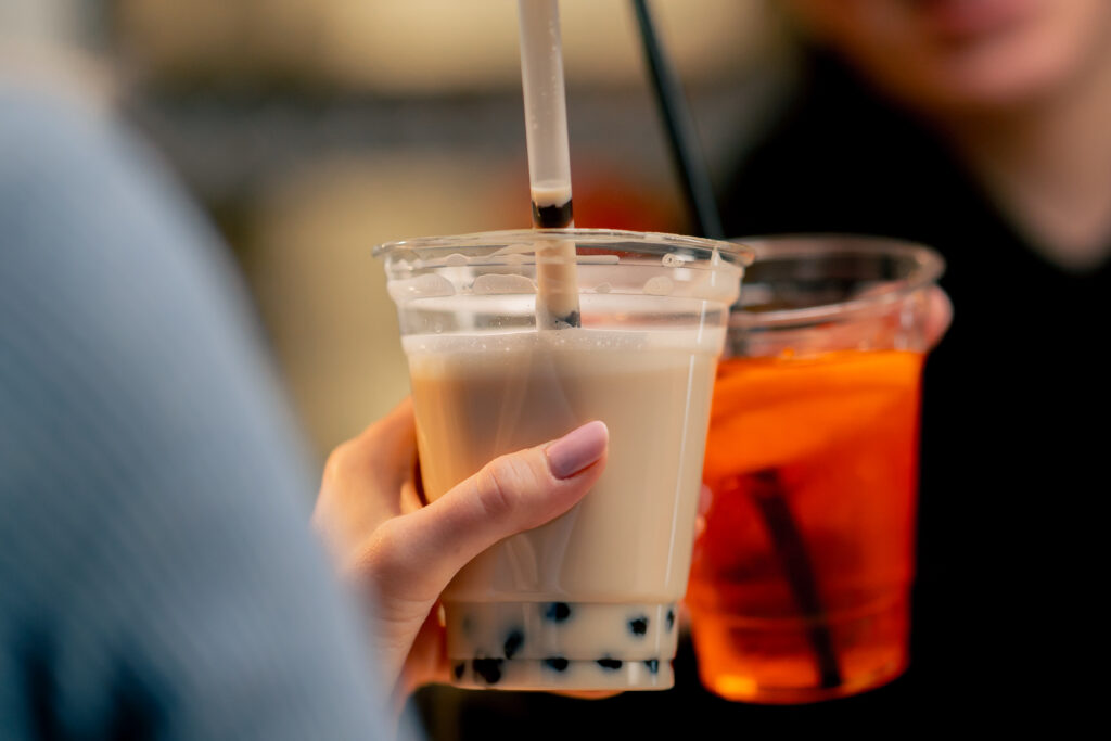 Close up of people toating bubble tea