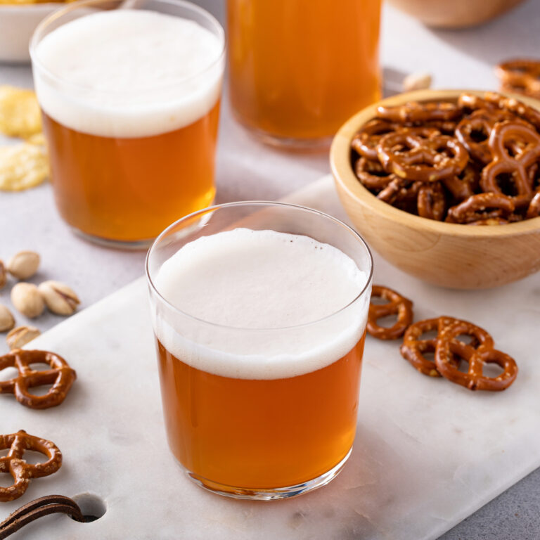 Glasses Of Beer With Pretzels At Oktoberfest in Brighton