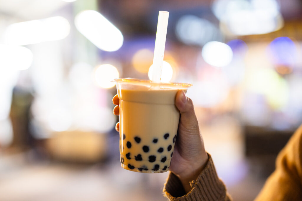 Hand Holding Refreshing Bubble Tea At Night 