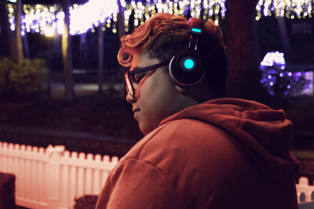 Male Listening To Music With His Headphones