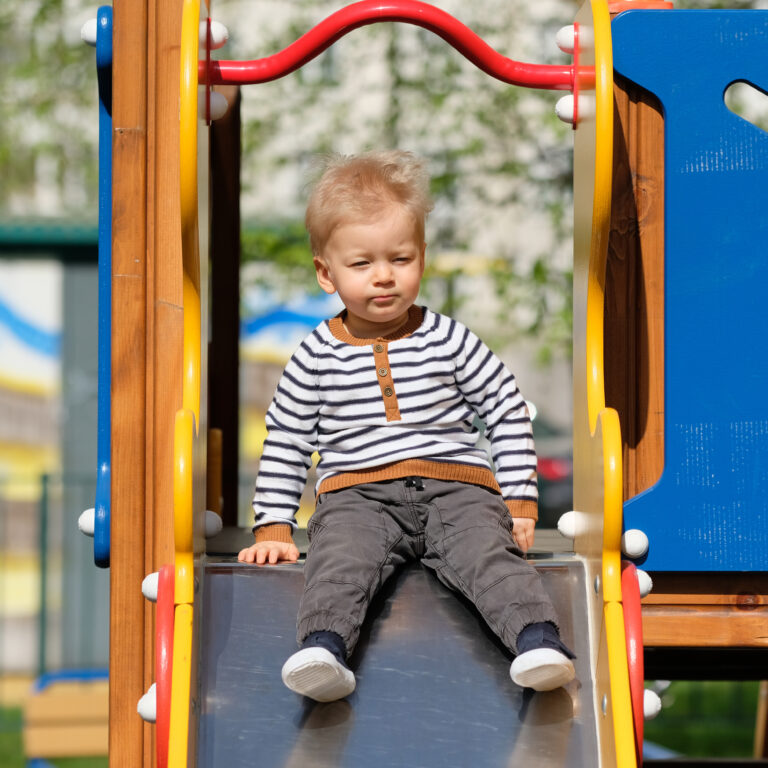 Portrait Of Toddler Child Outdoors at one of the Playgrounds in Brighton